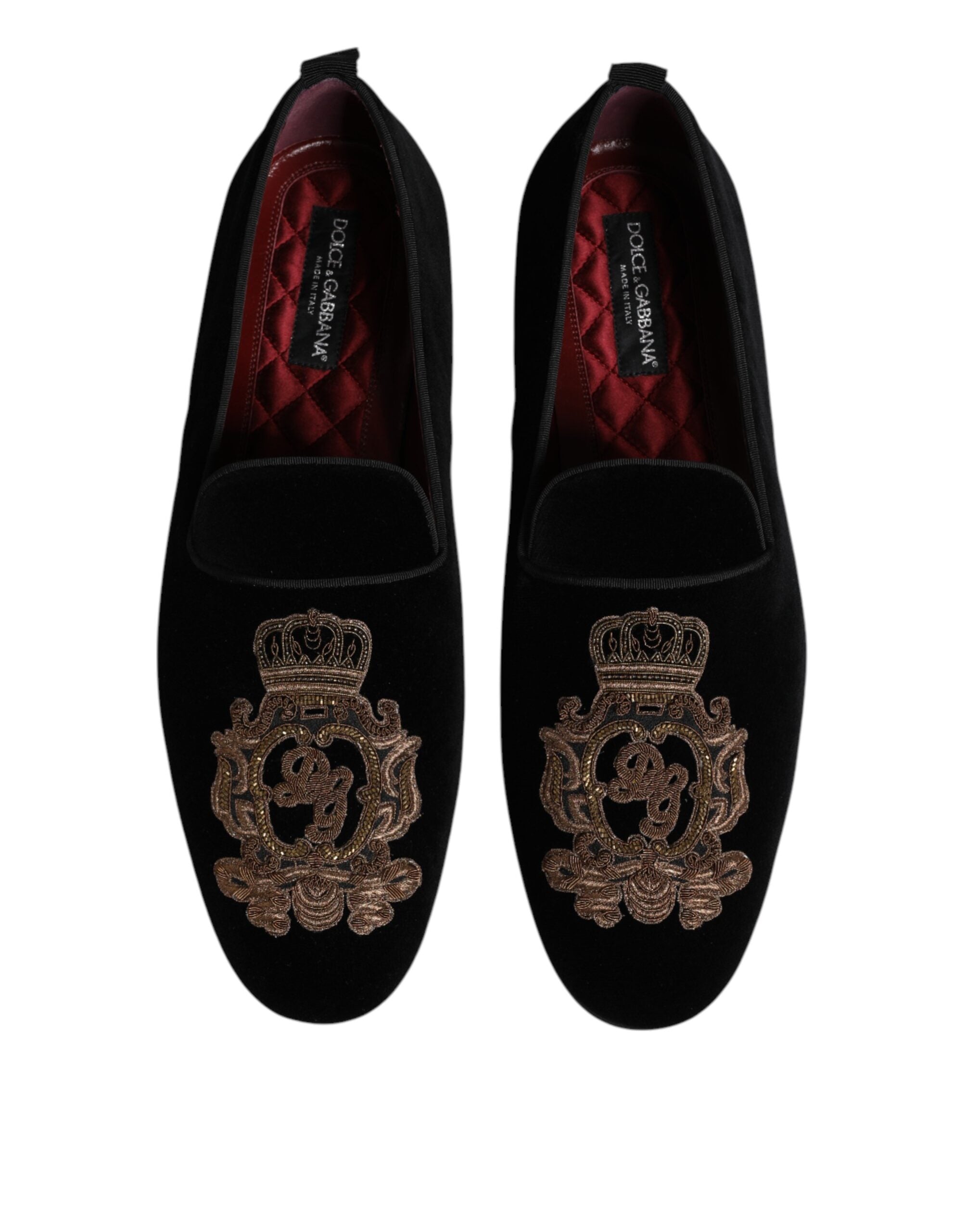 Step into unparalleled elegance with Dolce & Gabbana's Black Velvet Gold Crown Loafers, where exquisite craftsmanship meets opulent design, perfect for any sophisticated occasion.