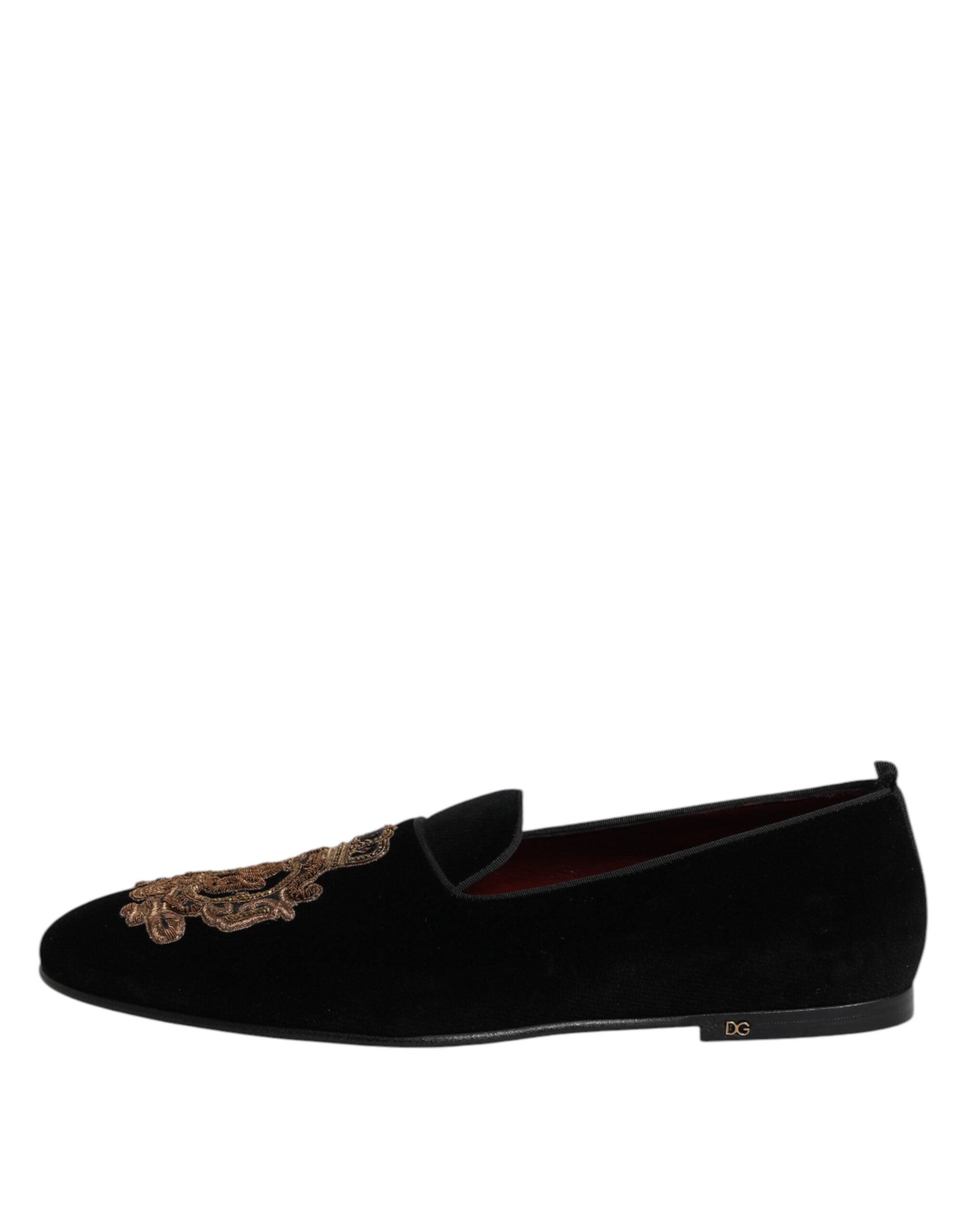 Step into a realm of opulence with Dolce & Gabbana's Black Velvet Gold Crown Loafers, where exquisite craftsmanship meets timeless elegance, perfect for the discerning connoisseur.