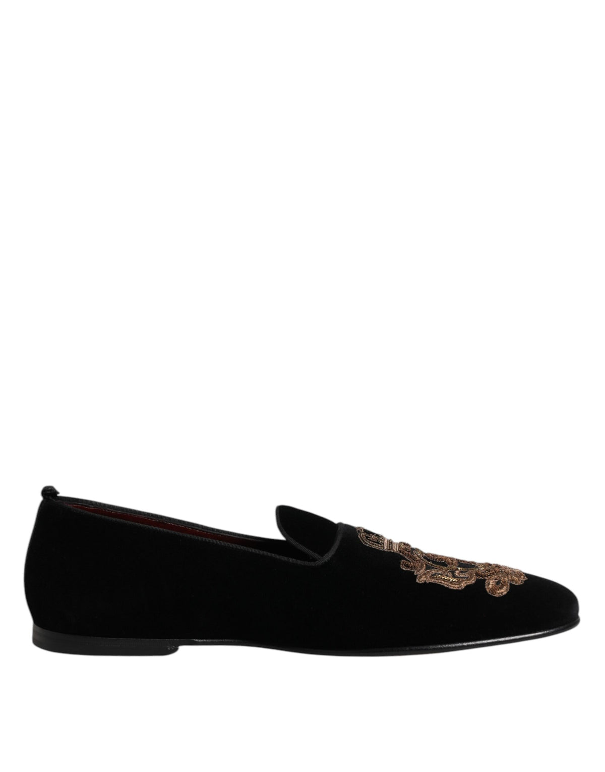 Indulge in the exquisite craftsmanship of Dolce & Gabbana's Black Velvet Gold Crown Loafers, where luxurious materials meet timeless elegance for the discerning connoisseur.