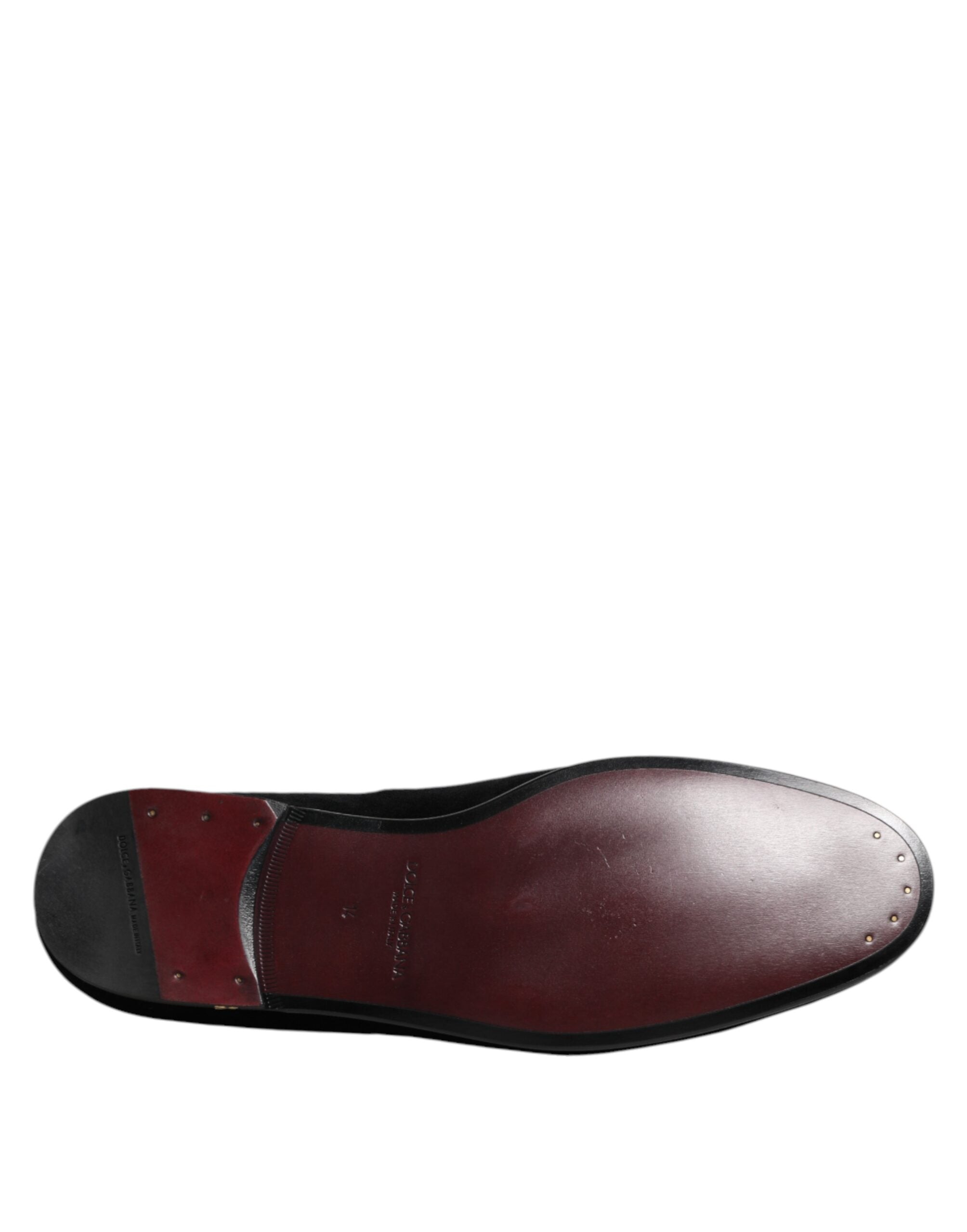 Indulge in the exquisite elegance of Dolce & Gabbana Black Velvet Gold Crown Mens Loafers, where Italian craftsmanship meets luxurious comfort, perfect for any refined occasion.