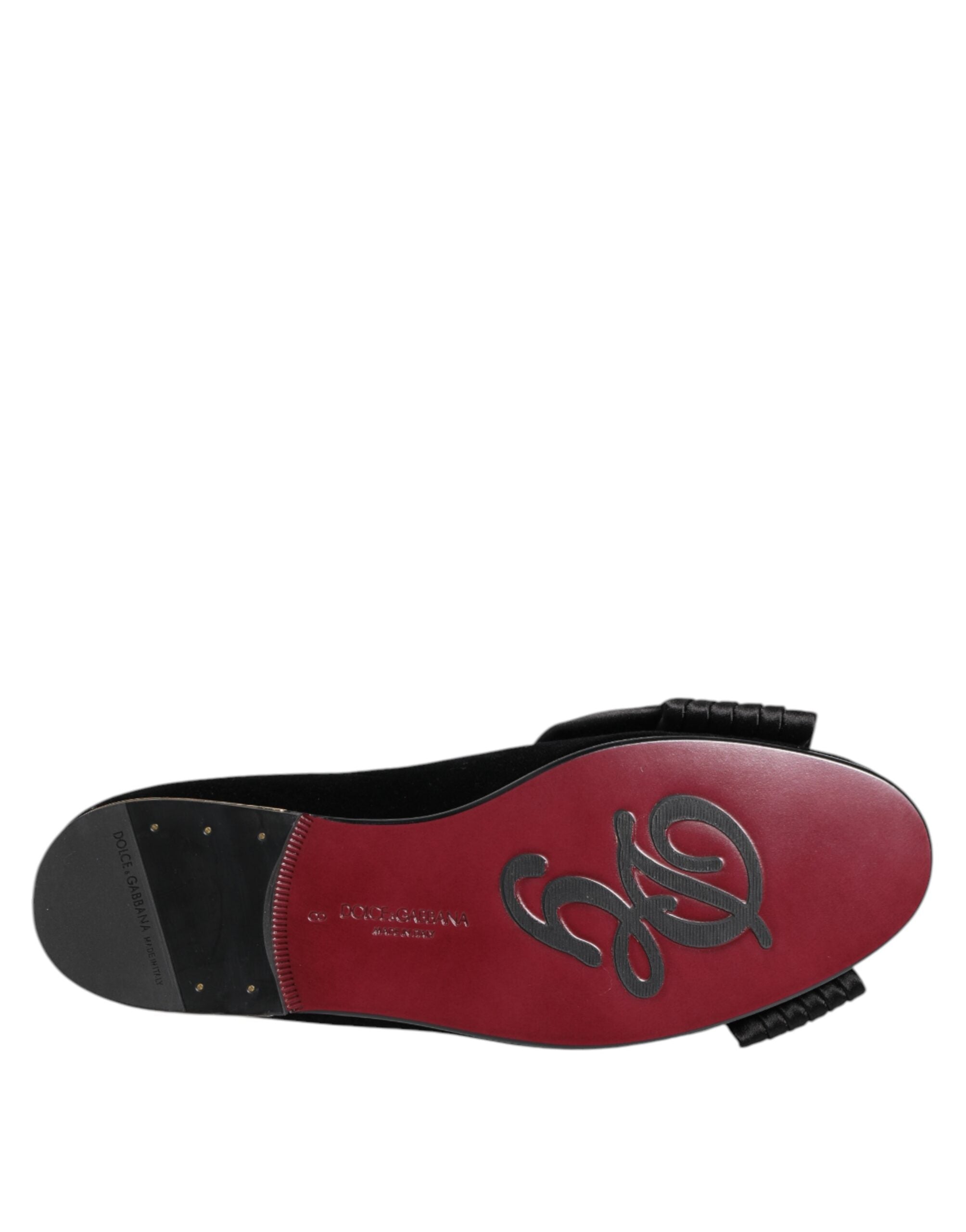 Step into opulence with Dolce & Gabbana's VATICANO Crystal Ribbon Slip On Shoes, where exquisite craftsmanship meets luxurious materials for the discerning individual.