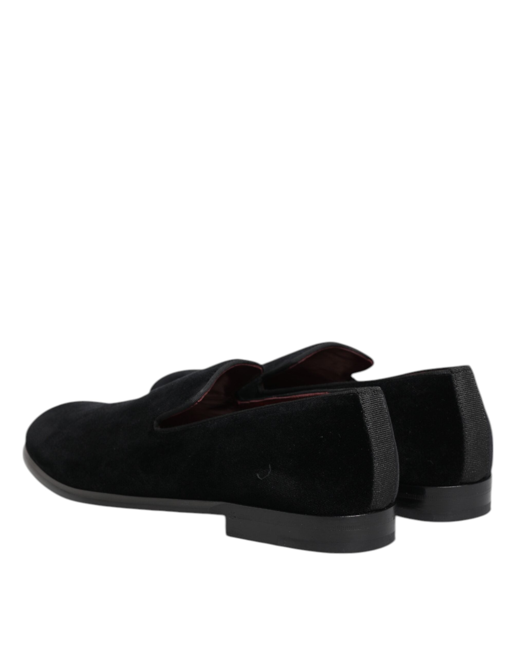 Indulge in the exquisite Dolce & Gabbana Black Velvet Loafers, where Italian craftsmanship meets timeless elegance, perfect for the discerning individual seeking luxury.