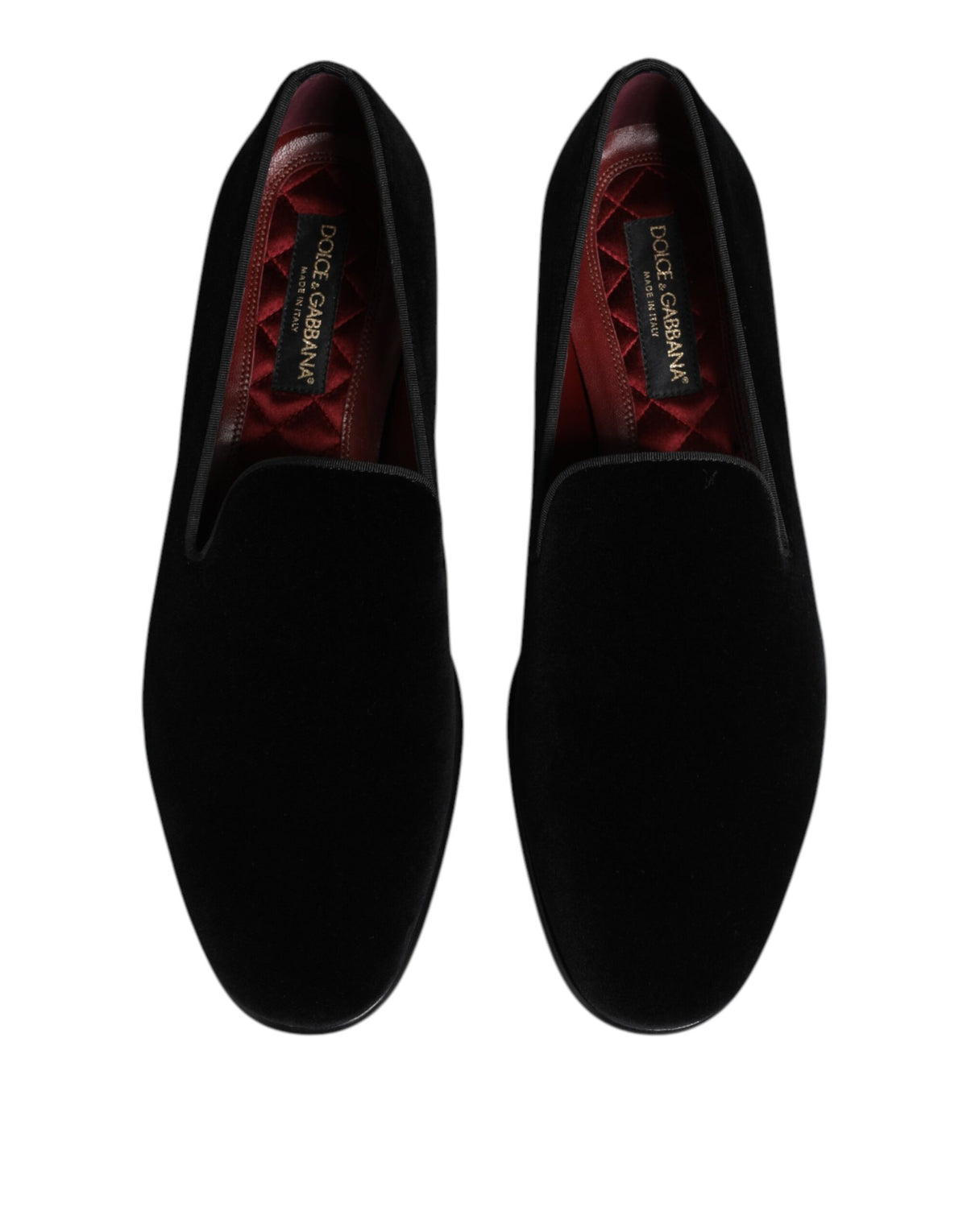Elevate your style with Dolce & Gabbana Black Velvet Slip On Loafers, a masterpiece of Italian craftsmanship, blending luxurious velvet and timeless elegance for the discerning individual.