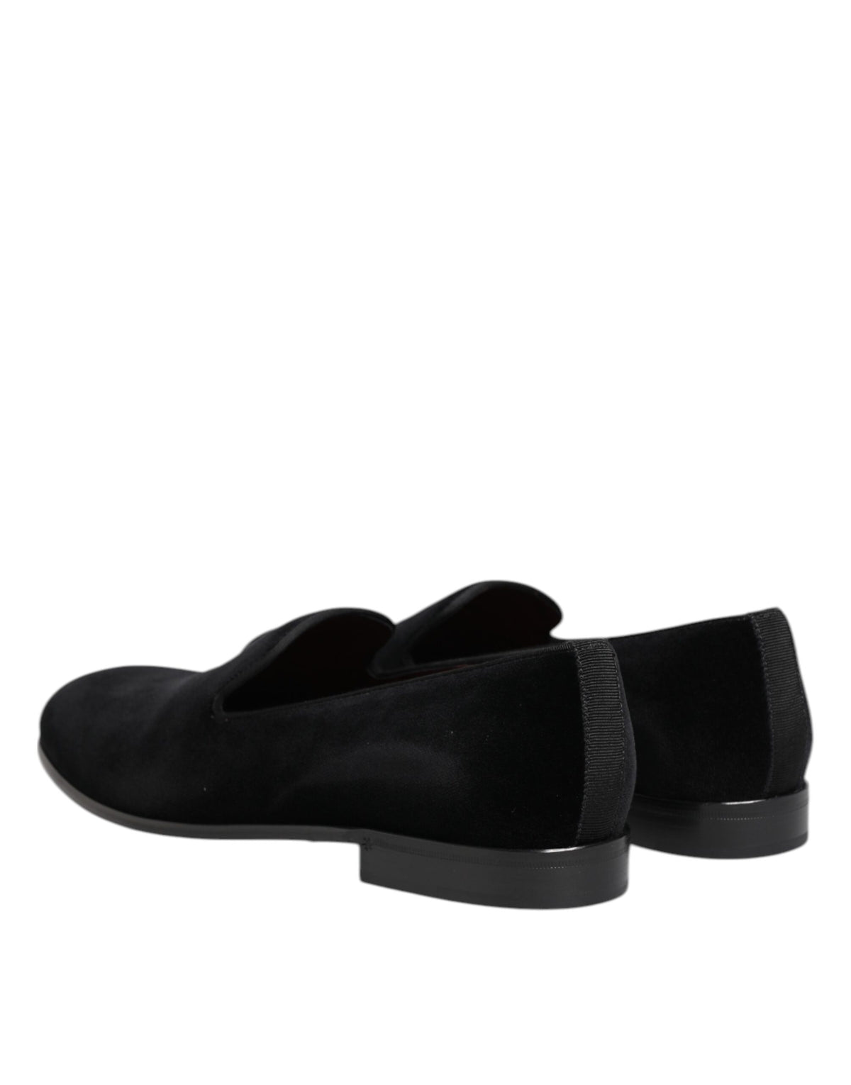 Step into elegance with Dolce & Gabbana's Black Velvet Slip On Loafers, where sumptuous craftsmanship meets timeless luxury, perfect for the discerning individual.