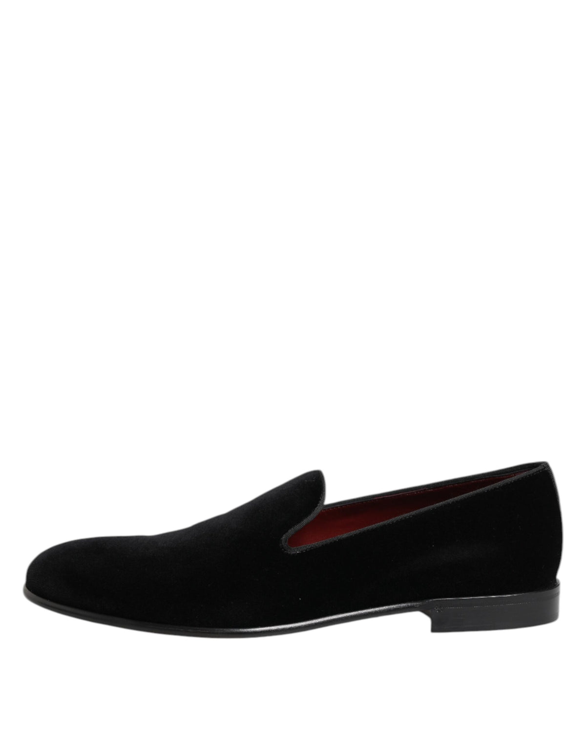 Indulge in the exquisite allure of Dolce & Gabbana Black Velvet Slip On Loafers, where sumptuous velvet meets artisanal craftsmanship for timeless elegance.