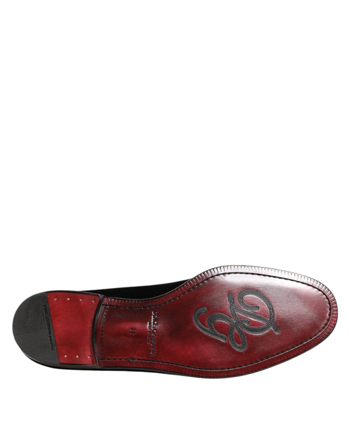 Elevate your style with Dolce & Gabbana Black Velvet Slip On Loafers, a masterpiece of Italian craftsmanship that embodies luxury and sophistication for the discerning individual.
