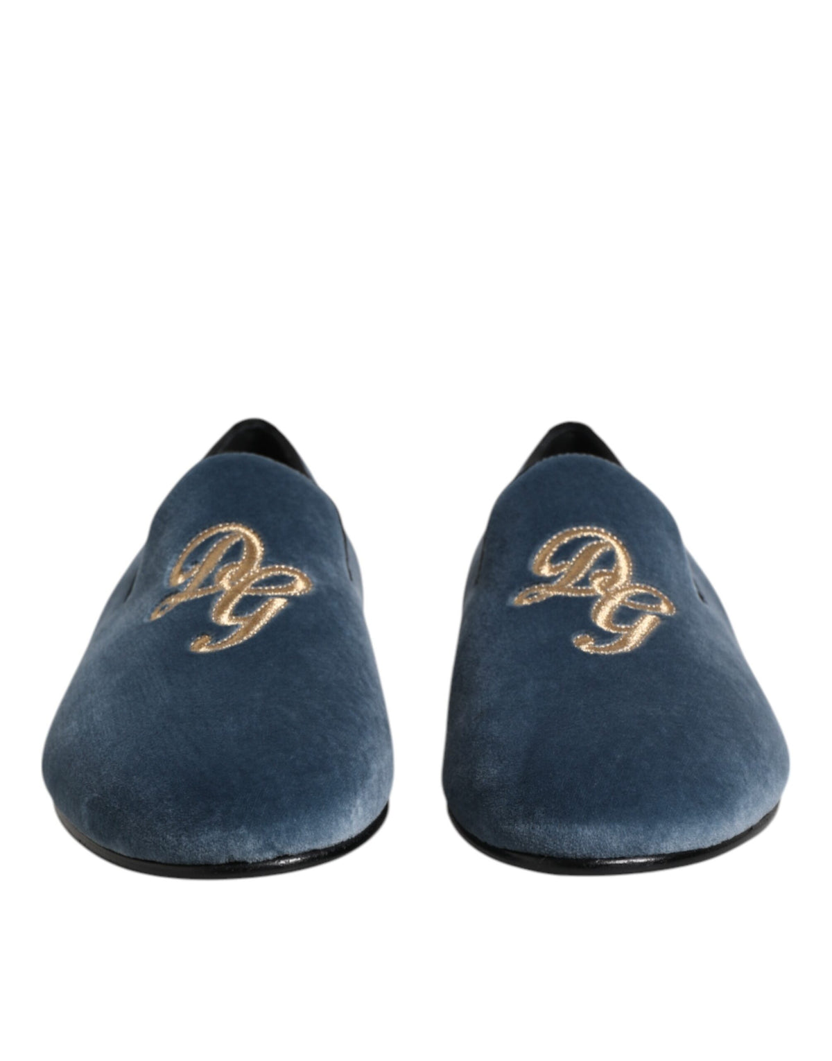 Indulge in the Dolce & Gabbana Blue Velvet DG Logo Loafers, where sumptuous velvet meets exquisite craftsmanship, embodying timeless luxury for the discerning individual.