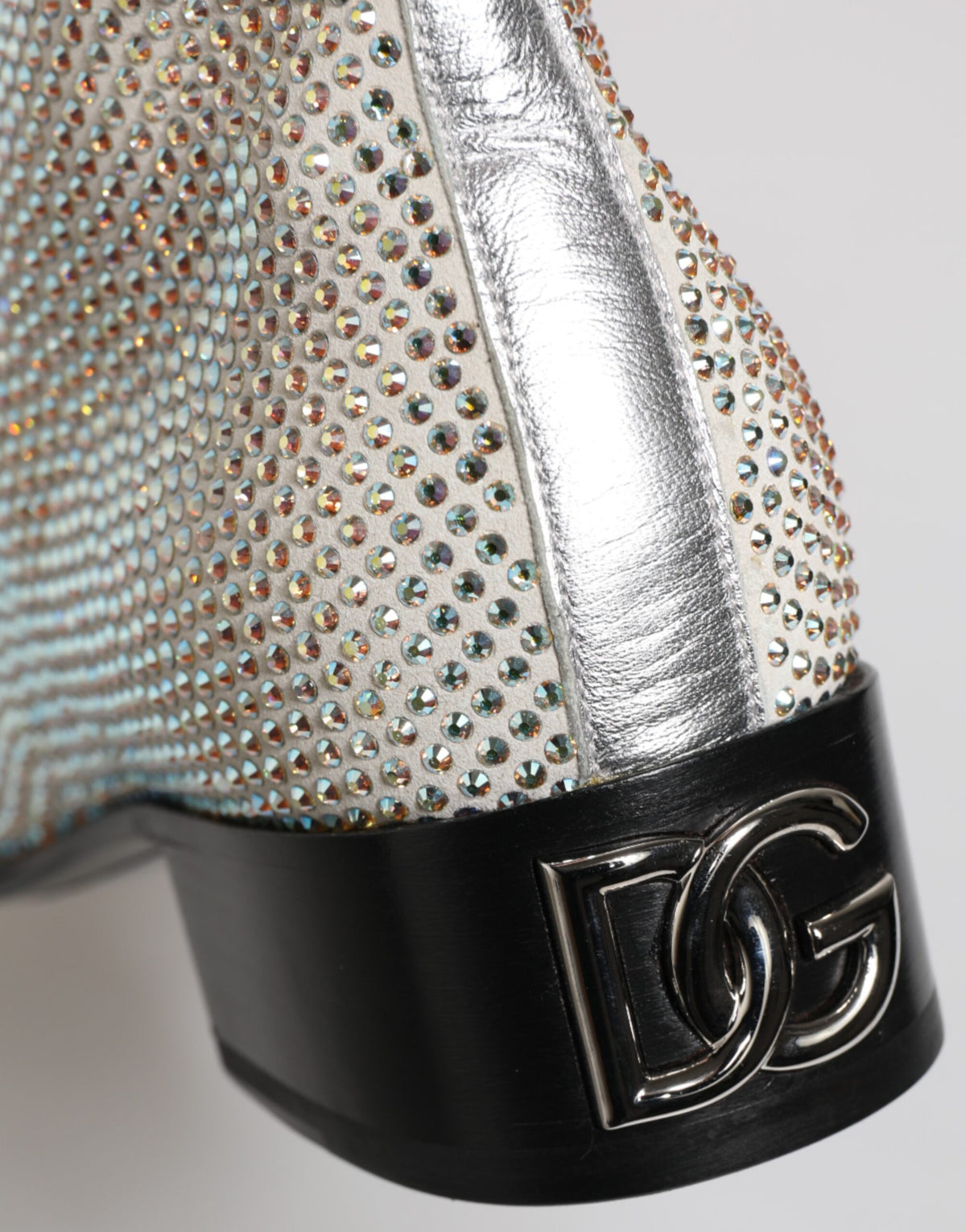 Step into luxury with Dolce & Gabbana's White Strass DG Logo Heels, where exquisite craftsmanship meets opulent design, perfect for the discerning fashion connoisseur.