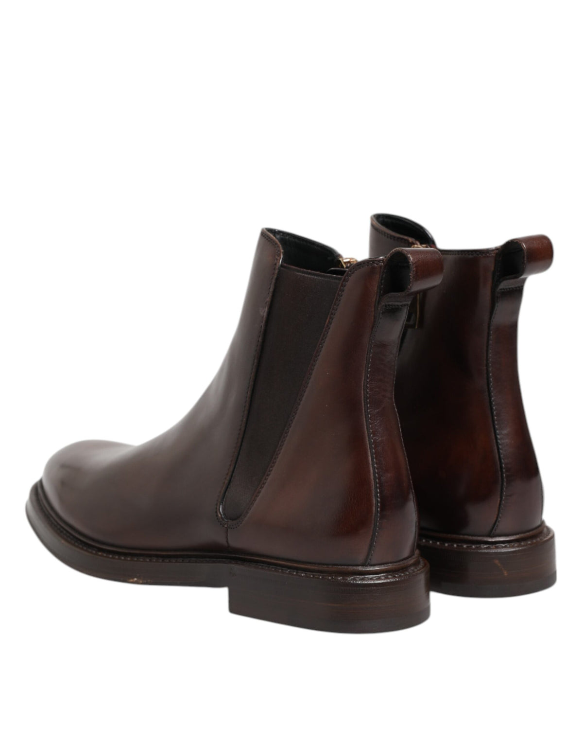 Discover the exquisite Dolce & Gabbana Brown Chelsea Leather Mid Calf Boots, where Italian craftsmanship meets timeless elegance, perfect for the discerning individual.