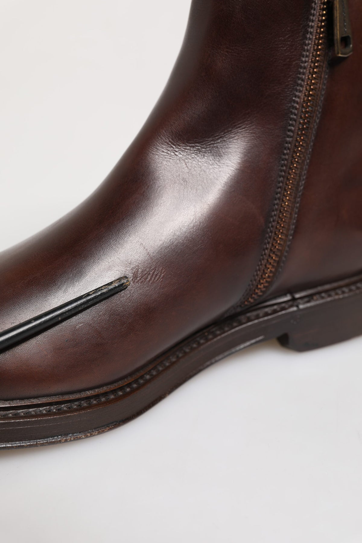 Experience the allure of Dolce & Gabbana's Brown Chelsea Leather Mid Calf Boots, where Italian craftsmanship meets timeless elegance, perfect for any sophisticated occasion.
