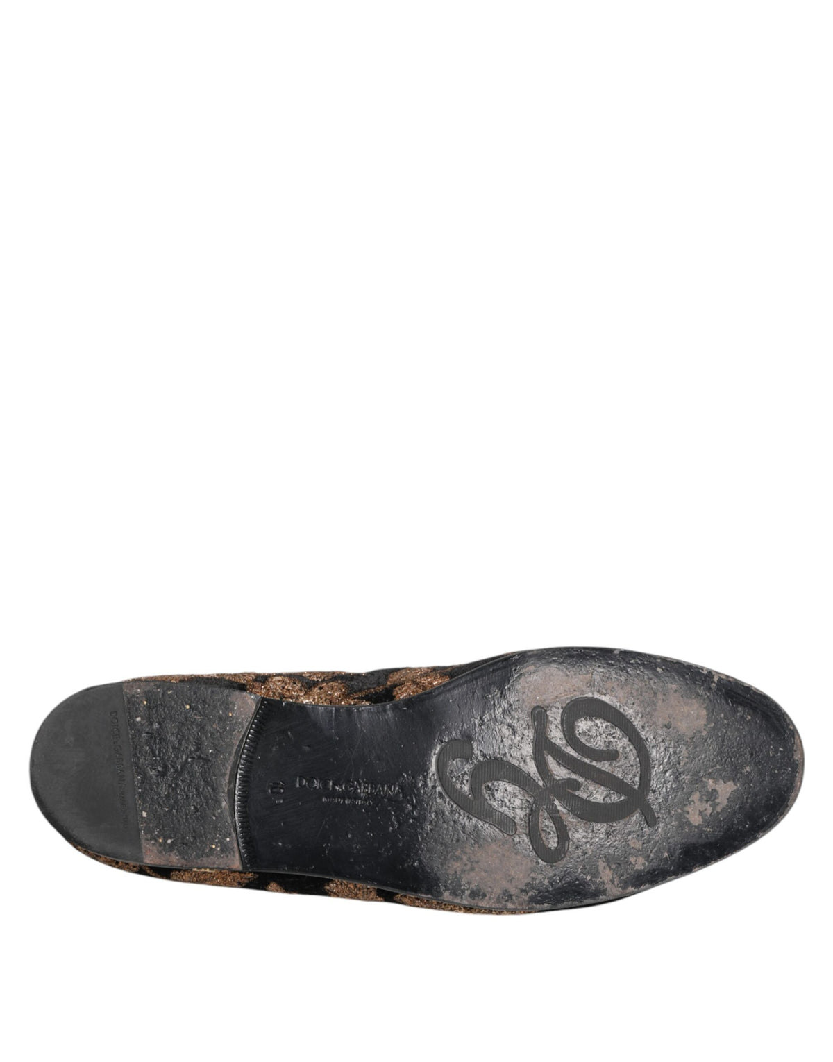 Step into opulence with Dolce & Gabbana's Black Floral Embroidery Loafers, where exquisite velvet and gold embroidery redefine luxury for the discerning individual.