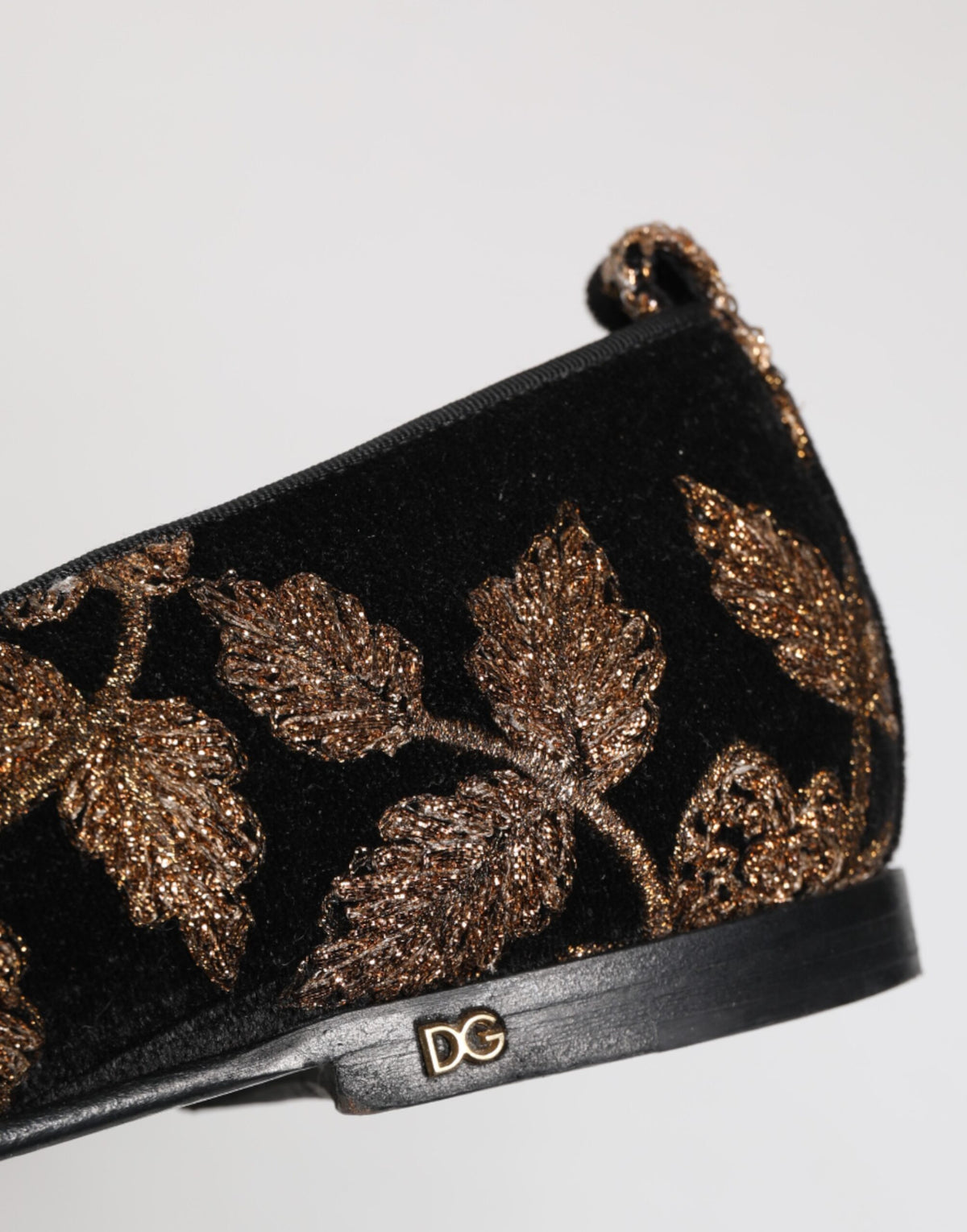 Experience the opulence of Dolce & Gabbana's Black Floral Embroidery Loafers, where exquisite velvet meets intricate gold detailing, embodying timeless elegance and sophistication.