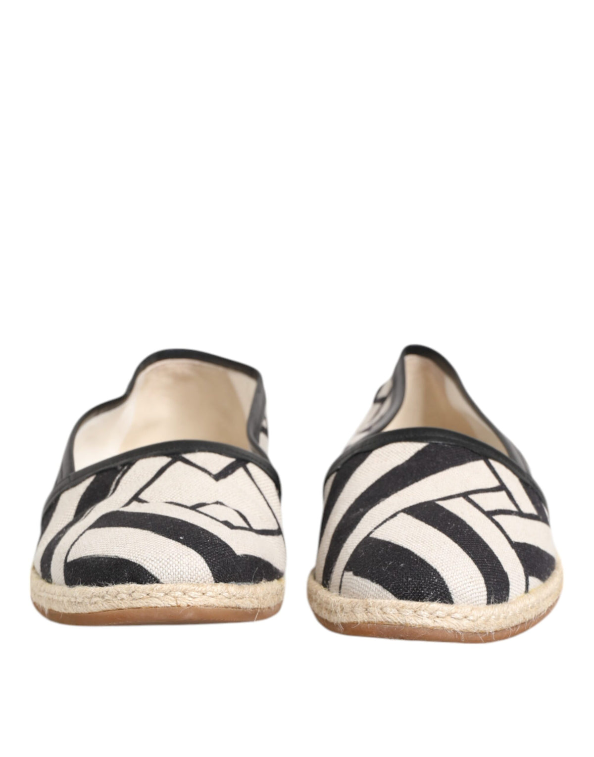 Experience the allure of Dolce & Gabbana's Black White Stripes Flat Espadrille Shoes, where Italian craftsmanship meets luxurious comfort for the discerning individual.