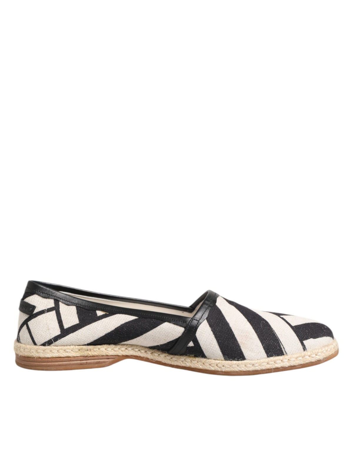 Experience the exquisite Dolce & Gabbana Black White Stripes Flat Espadrille Shoes, where Italian craftsmanship meets luxurious comfort, perfect for the discerning individual.
