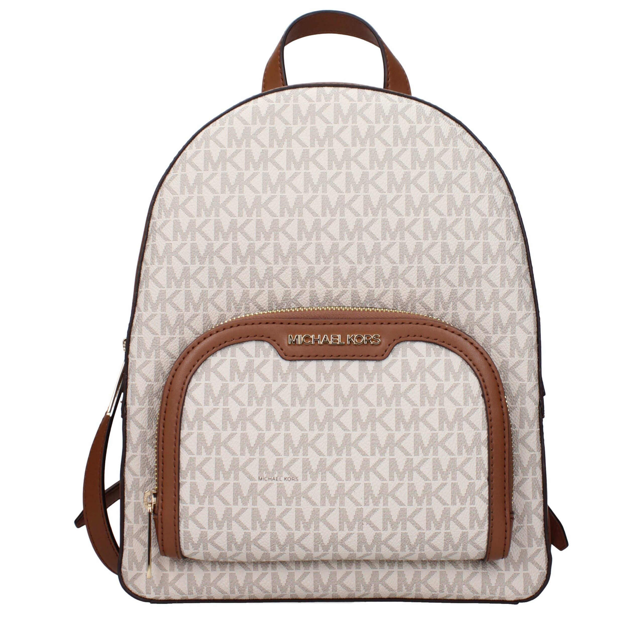 Indulge in the exquisite Michael Kors Beige Fabric Backpack, a luxurious blend of sophistication and practicality, perfect for the discerning individual seeking timeless elegance.