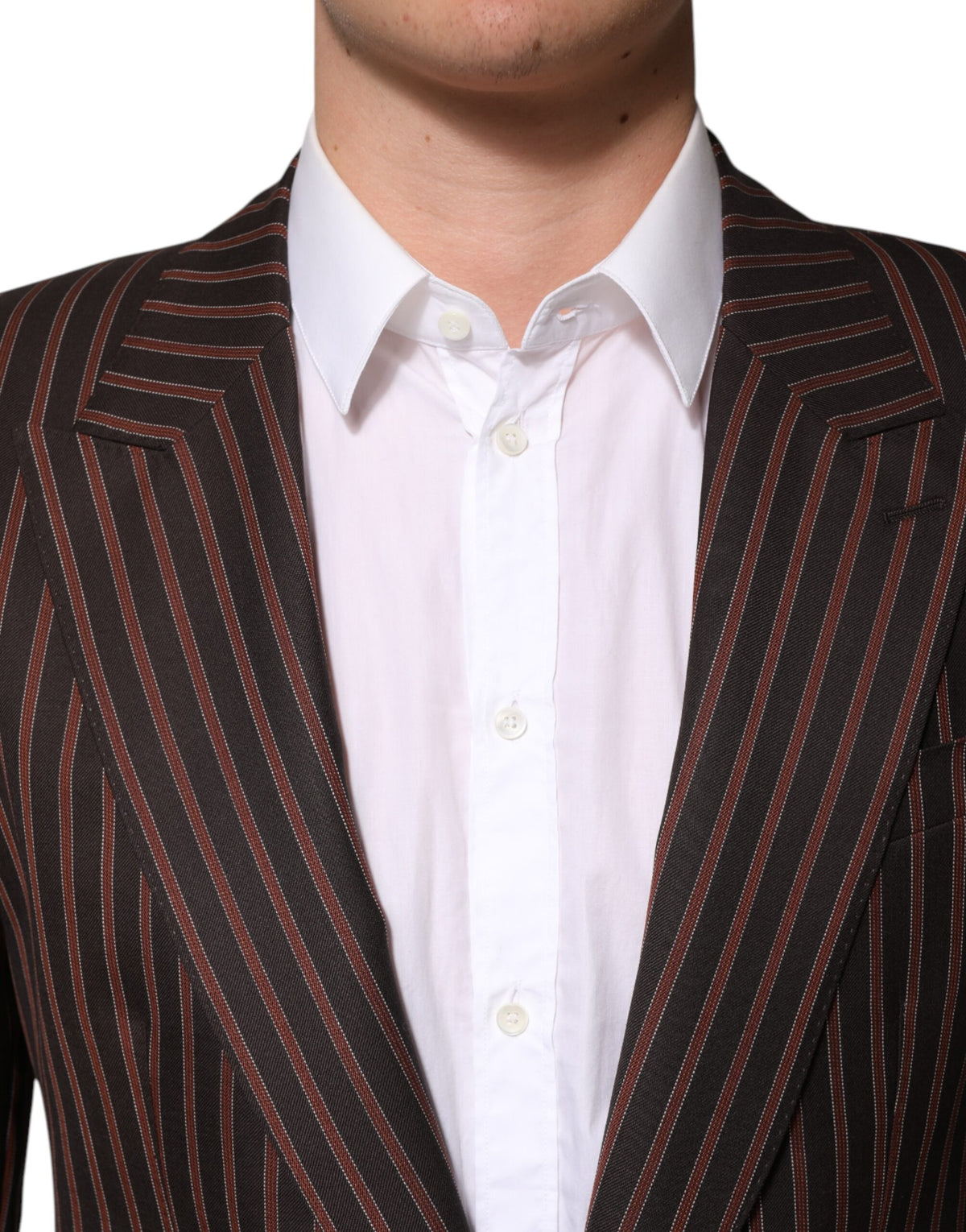 Elevate your wardrobe with the Dolce & Gabbana Black Brown Stripe Single Breasted Blazer, a masterpiece in virgin wool and silk, epitomizing timeless elegance and exquisite craftsmanship.
