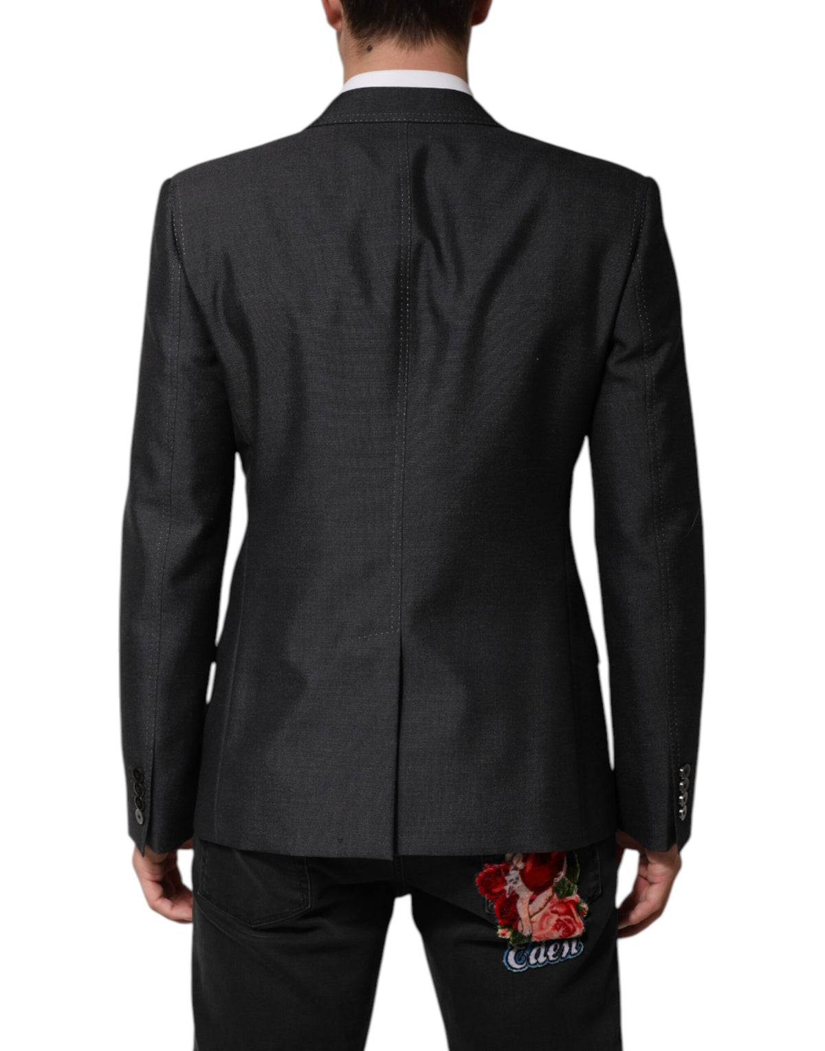 Indulge in the exquisite allure of the Dolce & Gabbana Dark Gray Bee Embroidery Wool Coat Blazer, a masterpiece of luxury craftsmanship that redefines elegance and sophistication.