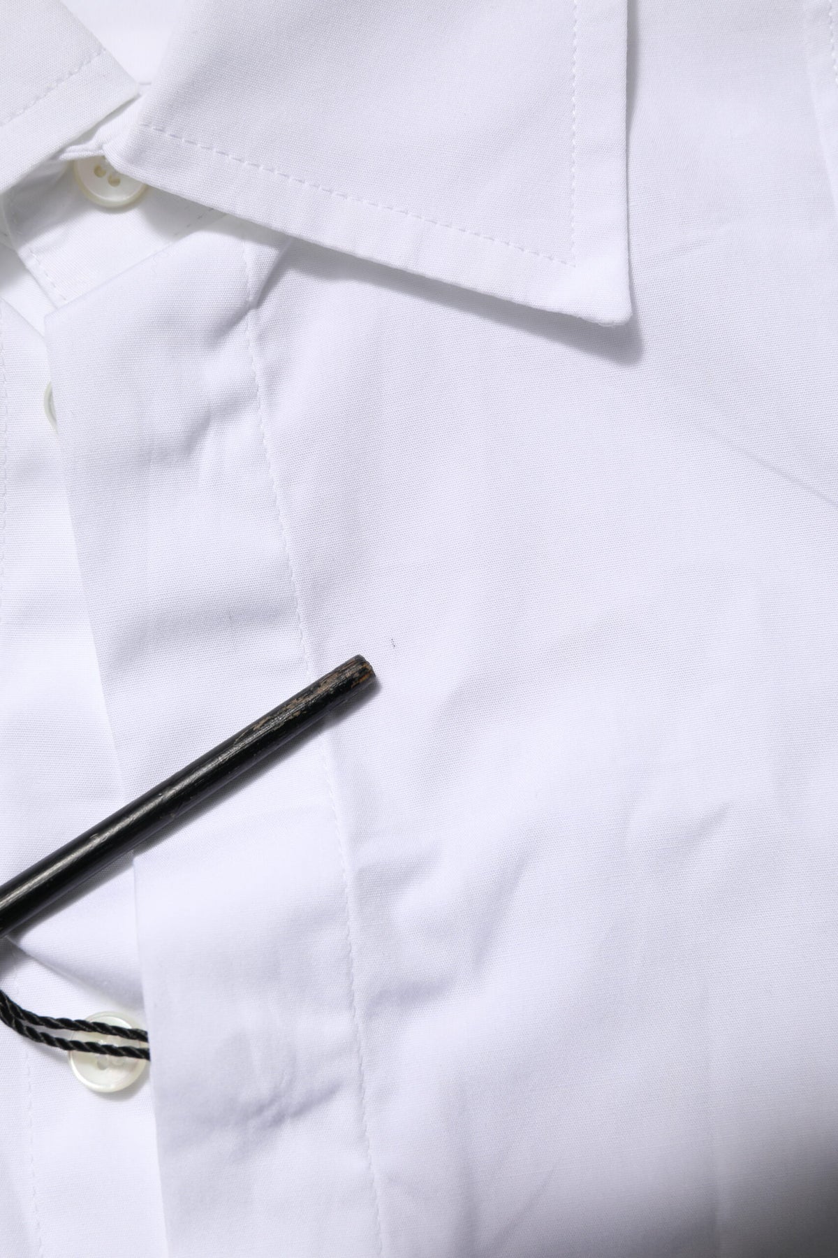 Discover the Dolce & Gabbana White Poplin Cotton Formal Men Dress Shirt, a masterpiece of Italian craftsmanship that embodies timeless elegance and sophisticated allure.
