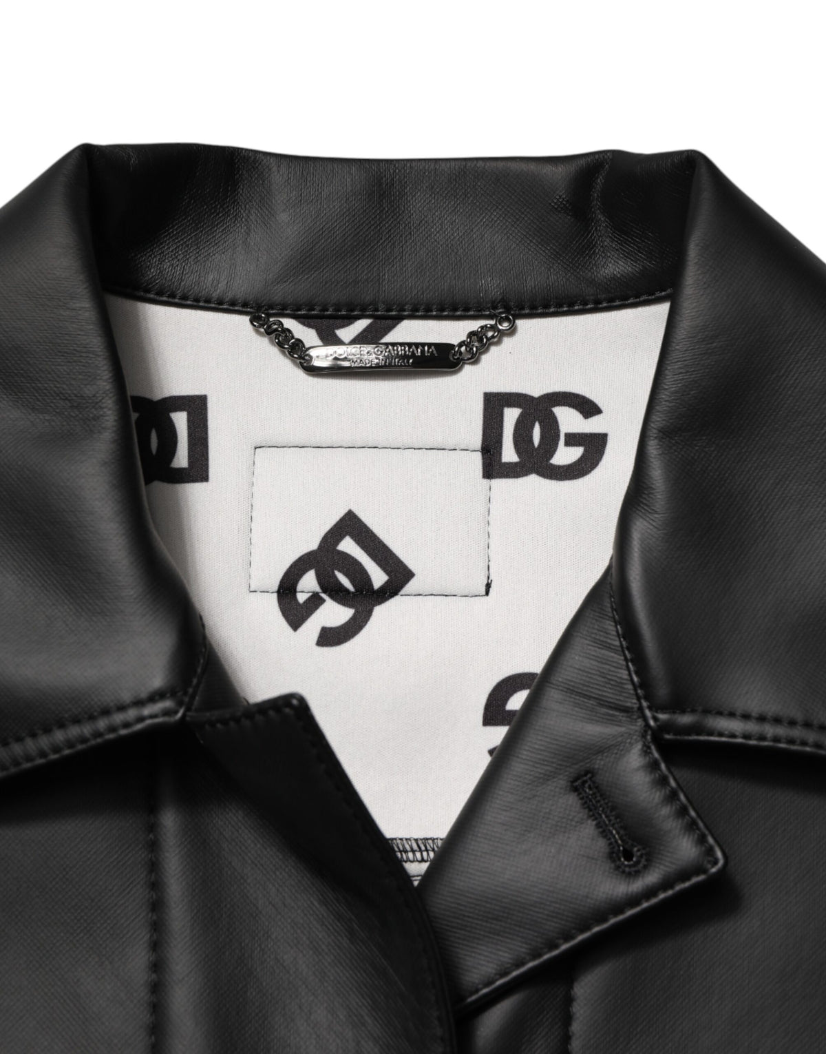 Experience the allure of the Dolce & Gabbana Black Polyester Button Down Biker Jacket, where exquisite Italian craftsmanship meets timeless elegance, redefining luxury for the discerning individual.