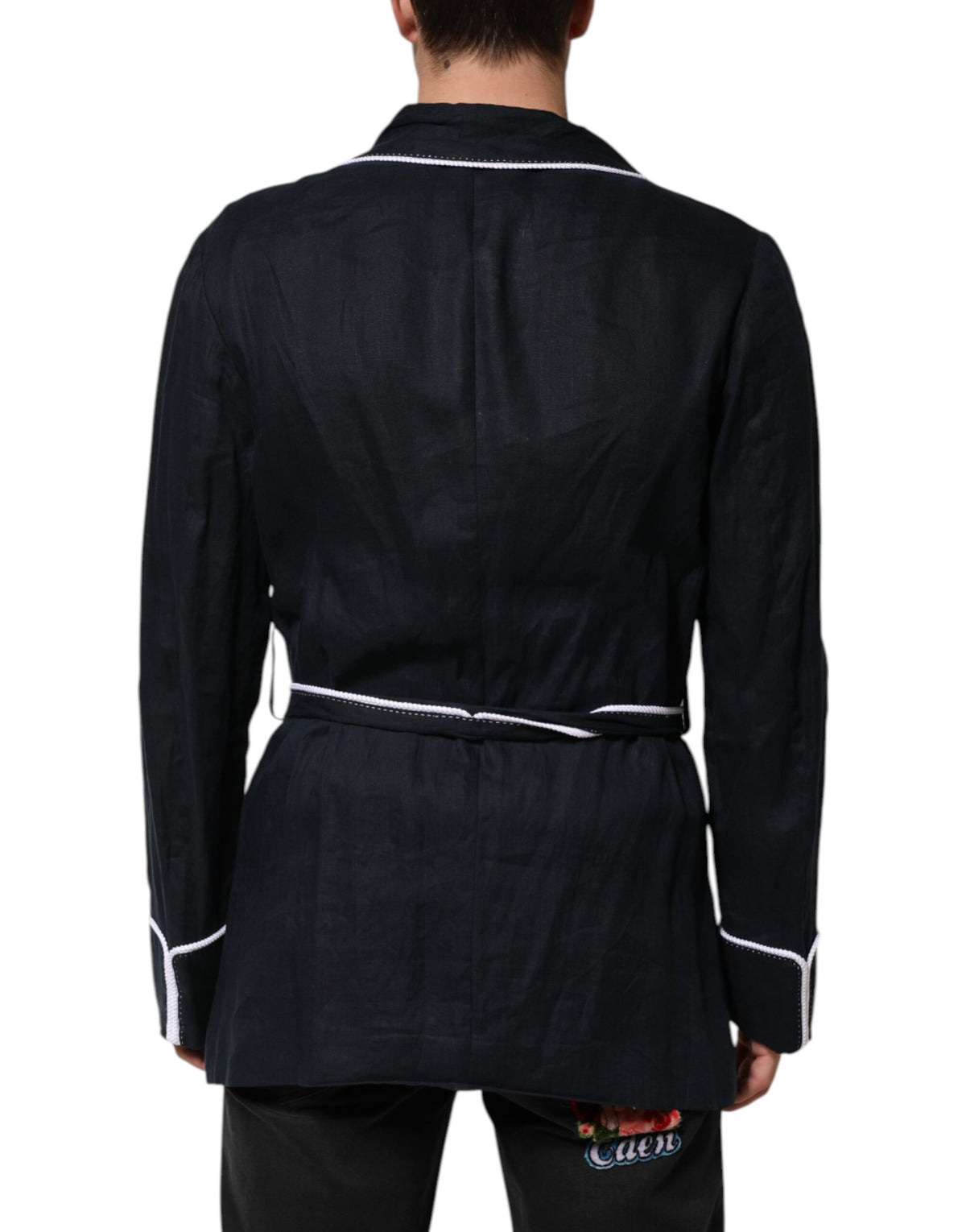 Elevate your wardrobe with the Dolce & Gabbana Dark Blue DG Embroidery Jacket, a luxurious 100% linen robe blazer that embodies timeless elegance and exquisite craftsmanship.