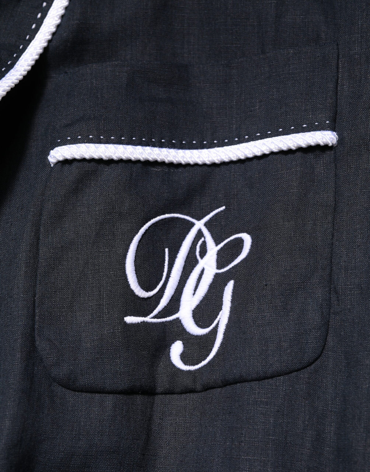 Elevate your wardrobe with the Dolce & Gabbana Dark Blue DG Embroidery Jacket Robe Blazer, a masterpiece of Italian craftsmanship in luxurious linen, embodying timeless elegance and sophistication.