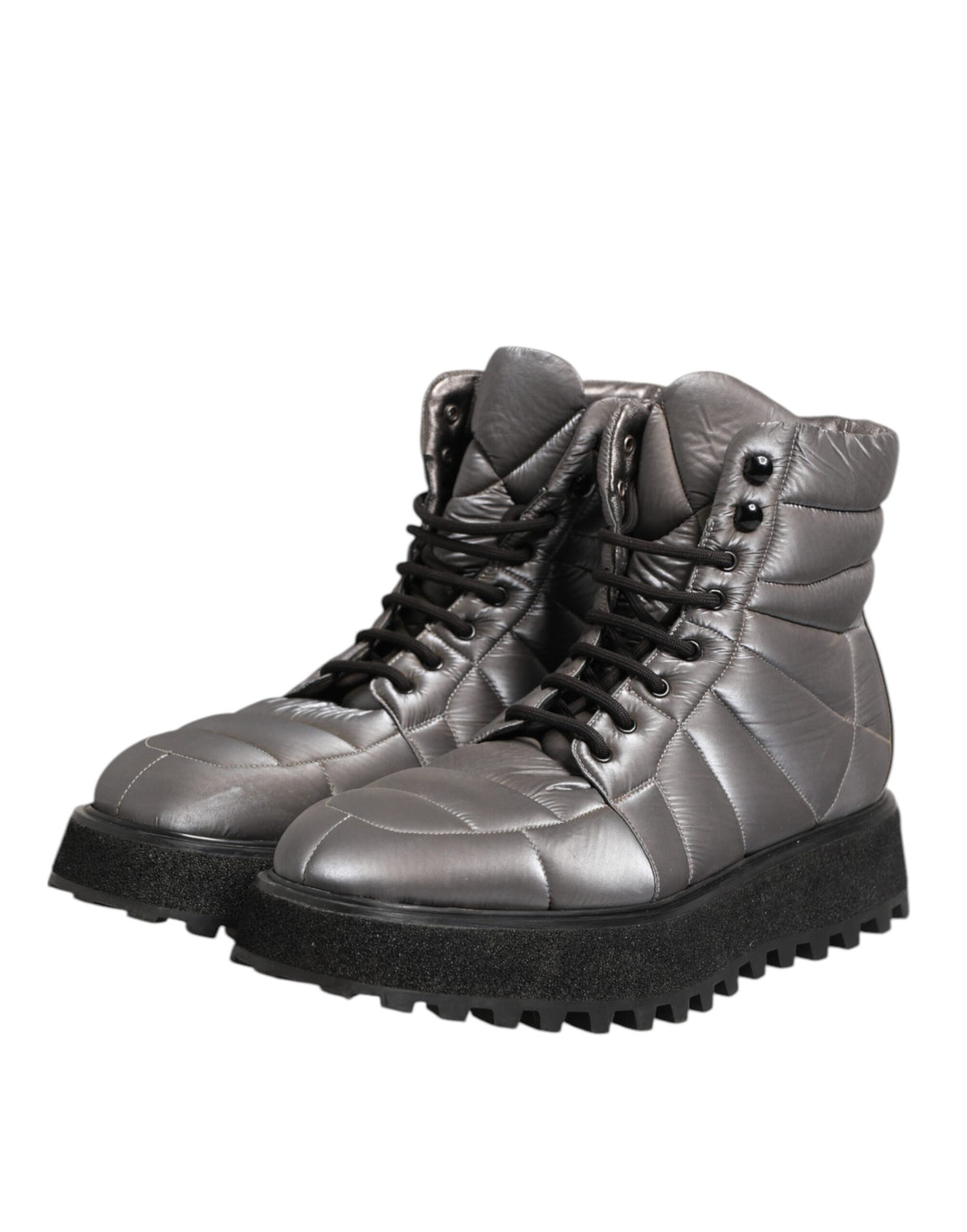 Elevate your style with Dolce & Gabbana's Silver Padded Mid Calf Lace Up Boots, a masterpiece of Italian craftsmanship, blending luxury and versatility for the discerning fashion connoisseur.