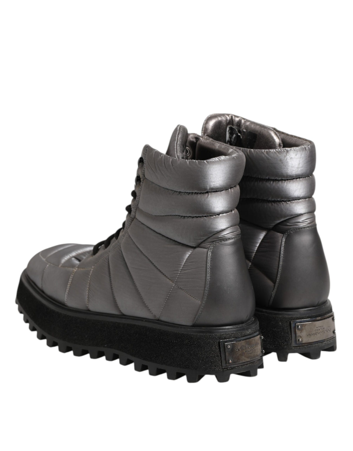 Elevate your style with Dolce & Gabbana's Silver Padded Mid Calf Lace Up Boots, where exquisite craftsmanship meets luxurious comfort for the discerning fashion aficionado.