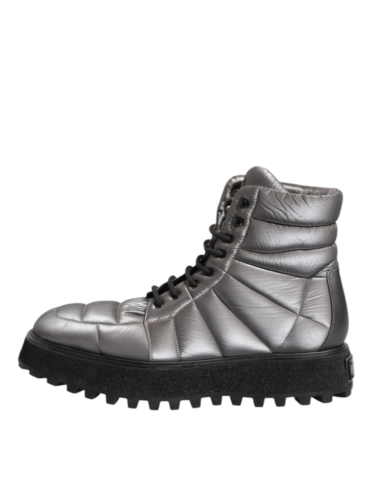 Step into luxury with Dolce & Gabbana's Silver Padded Mid Calf Lace Up Boots, crafted from premium materials for a sophisticated blend of comfort and style.
