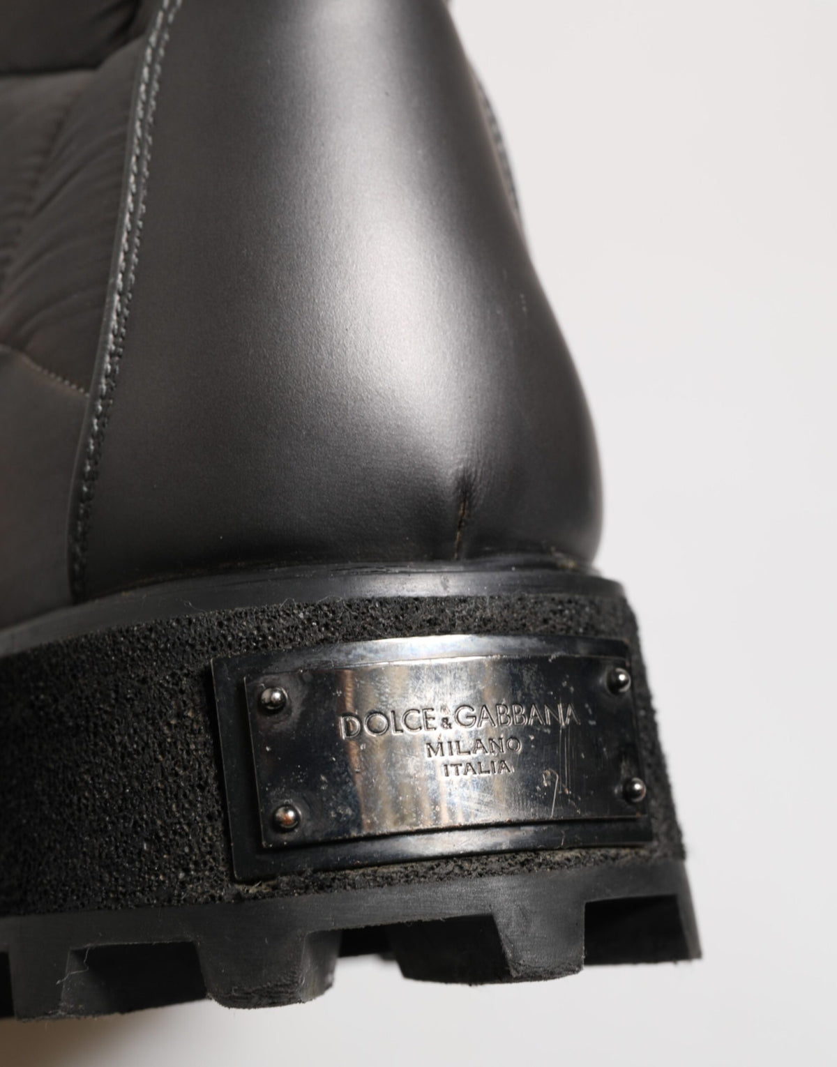 Experience the allure of Dolce & Gabbana's Silver Padded Mid Calf Lace Up Boots, where exquisite craftsmanship meets luxurious comfort for the discerning fashion aficionado.