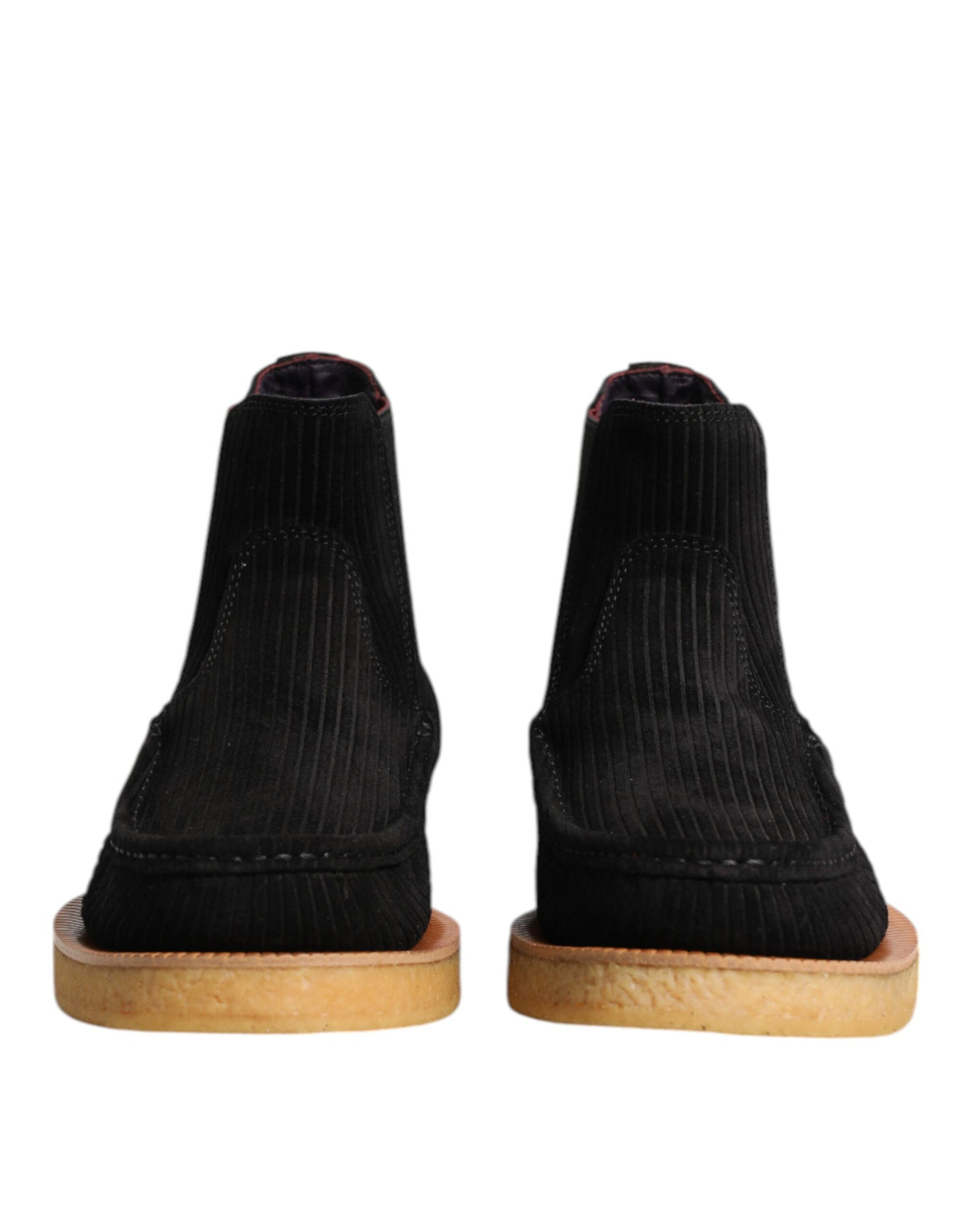 Indulge in the exquisite craftsmanship of Dolce & Gabbana's black calf suede slip-on ankle boots, where timeless luxury meets unparalleled comfort for a sophisticated lifestyle.
