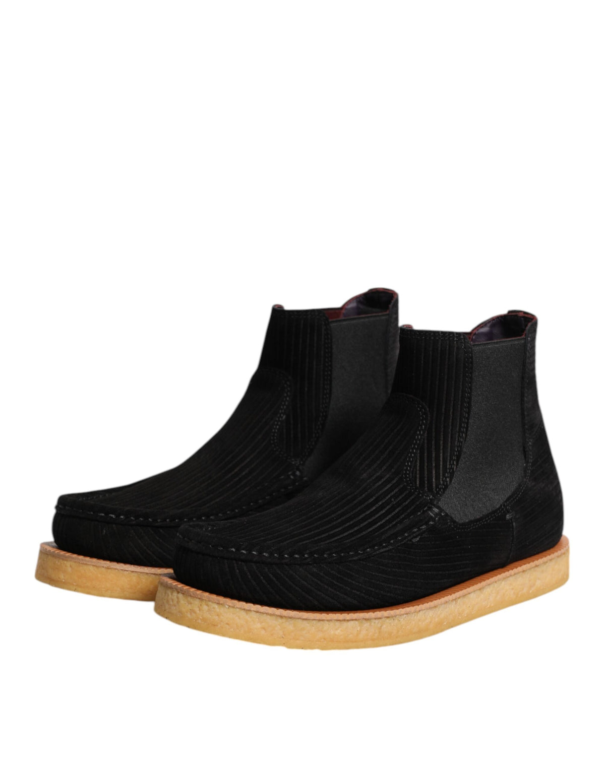 Elevate your wardrobe with Dolce & Gabbana's black calf suede slip-on ankle boots, a luxurious blend of exquisite craftsmanship and timeless elegance, perfect for any refined occasion.