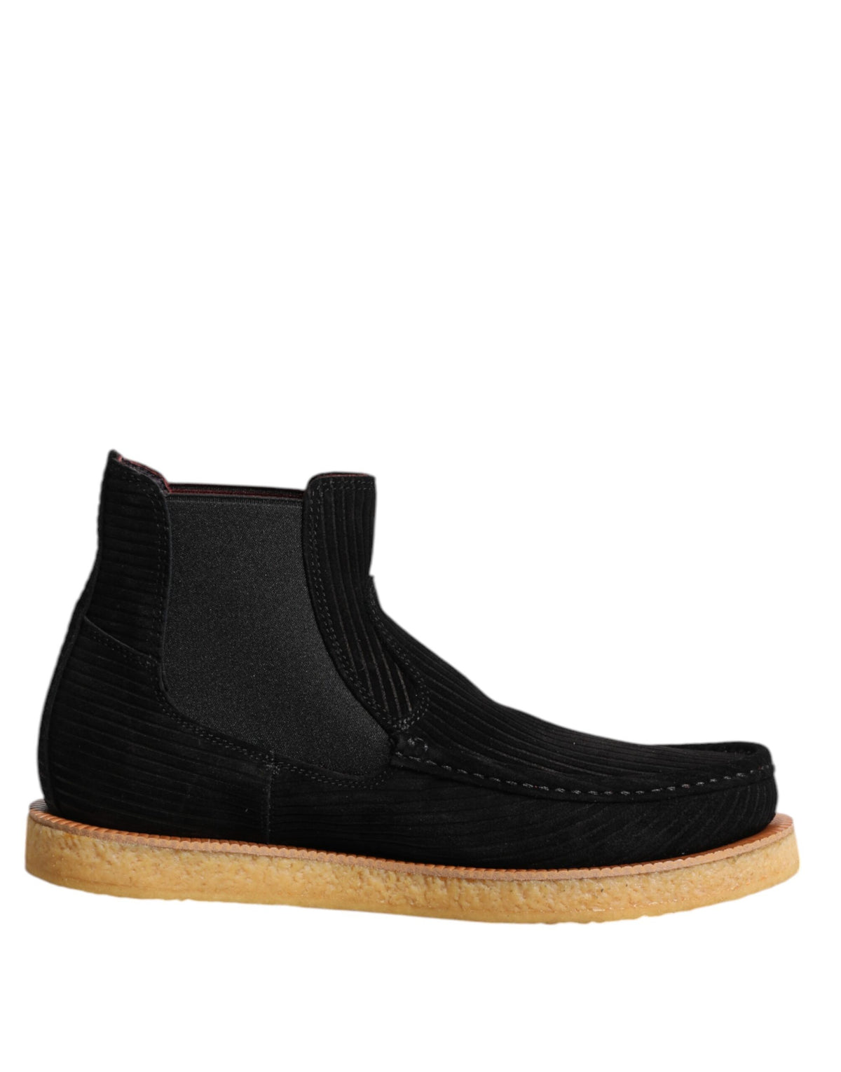 Indulge in the exquisite craftsmanship of Dolce & Gabbana's black calf suede slip-on ankle boots, where timeless luxury meets effortless elegance for the discerning individual.
