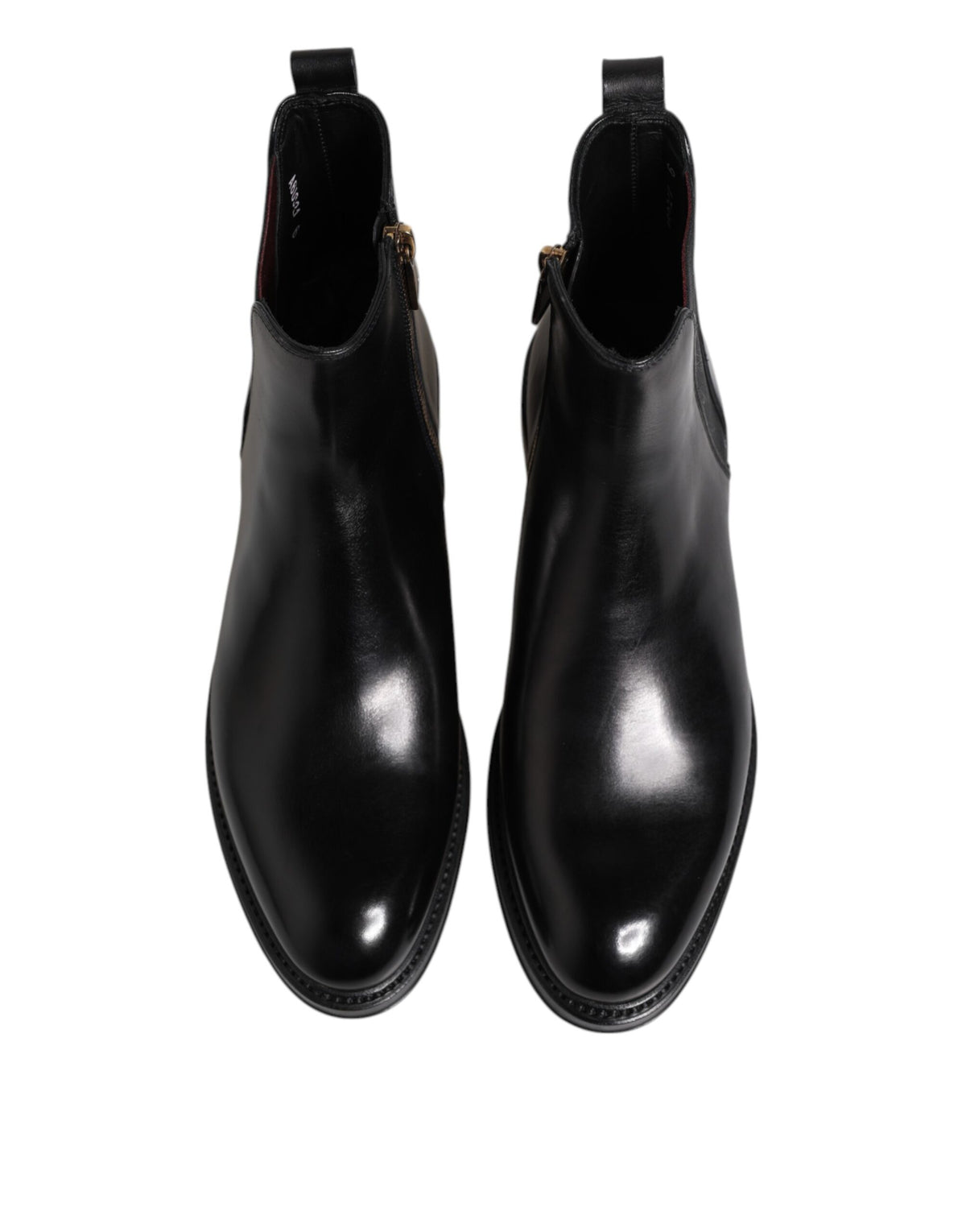 Step into a world of elegance with Dolce & Gabbana Black Chelsea Leather Mid Calf Boots, where exquisite craftsmanship meets luxurious comfort for the discerning individual.