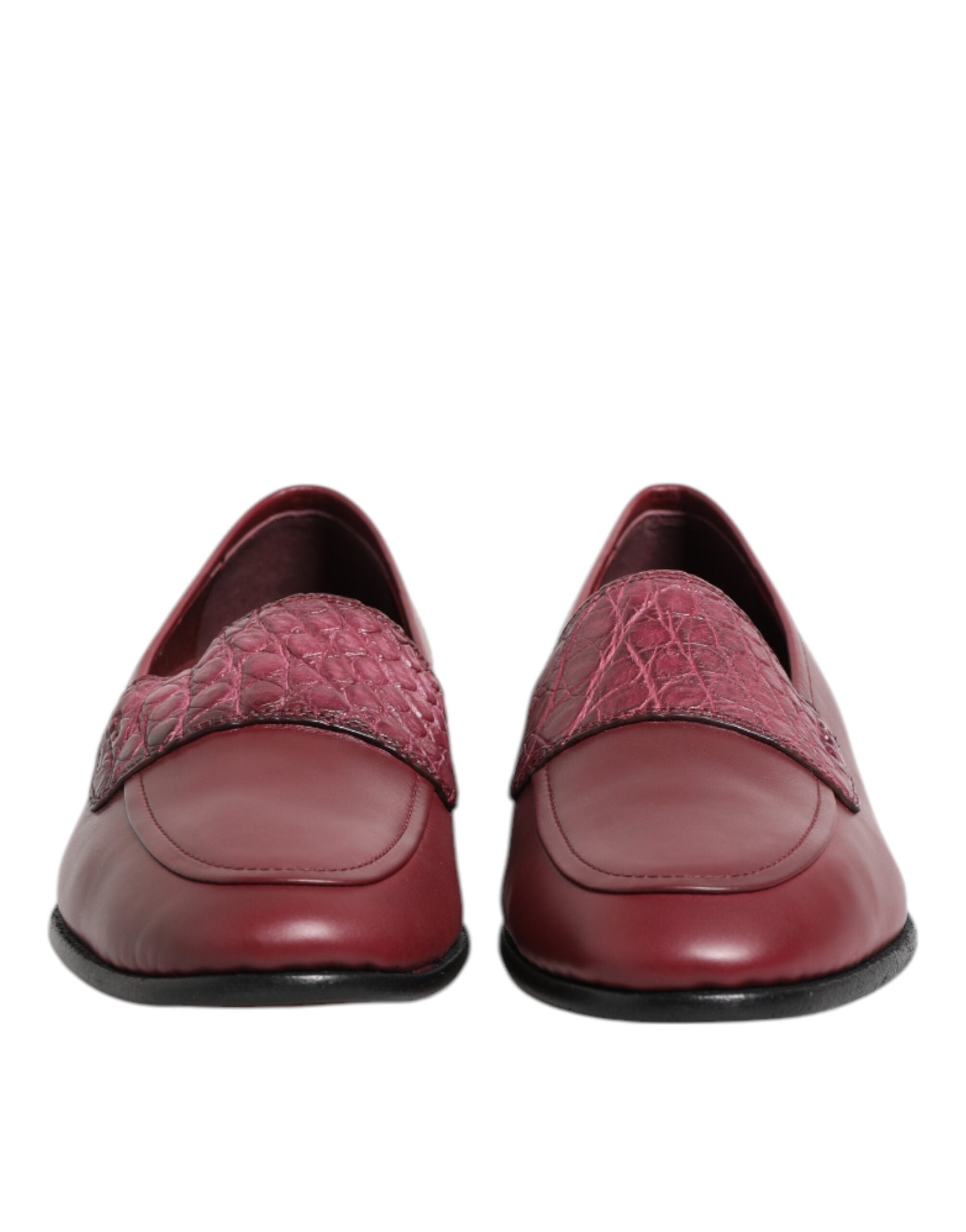 Indulge in the exquisite craftsmanship of Dolce & Gabbana's Burgundy Leather Formal Slip On Shoes, where luxurious calfskin and caiman leather redefine elegance for every sophisticated occasion.