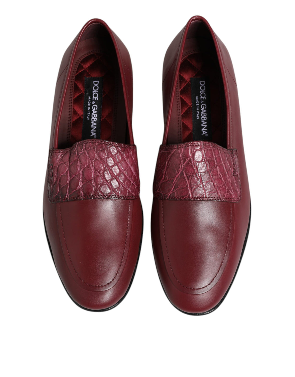Indulge in the exquisite allure of Dolce & Gabbana's Burgundy Leather Formal Slip On Shoes, crafted from luxurious calfskin and caiman leather for timeless elegance.