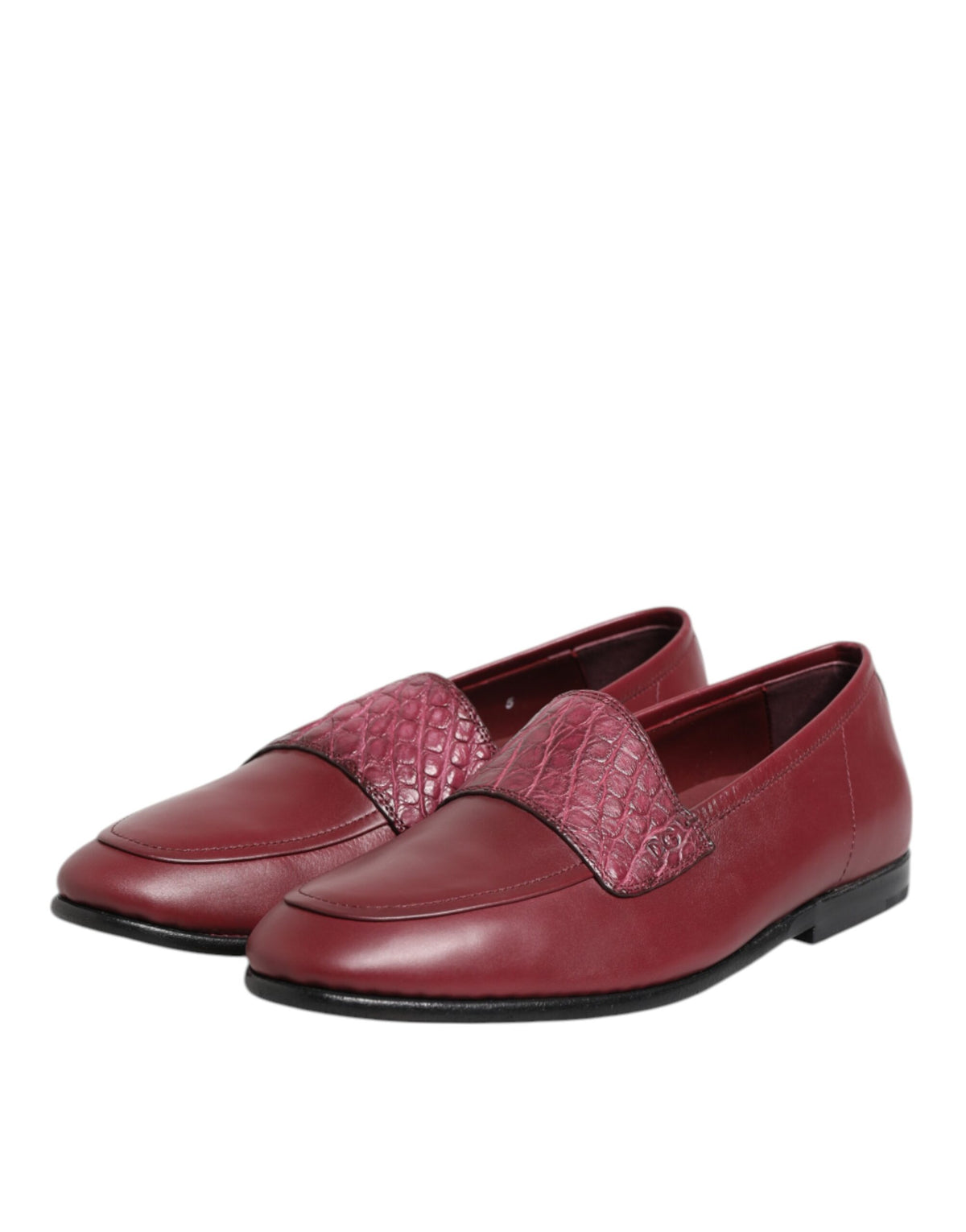 Indulge in the exquisite craftsmanship of Dolce & Gabbana's Burgundy Leather Formal Slip On Shoes, where luxurious materials meet timeless elegance for the discerning individual.