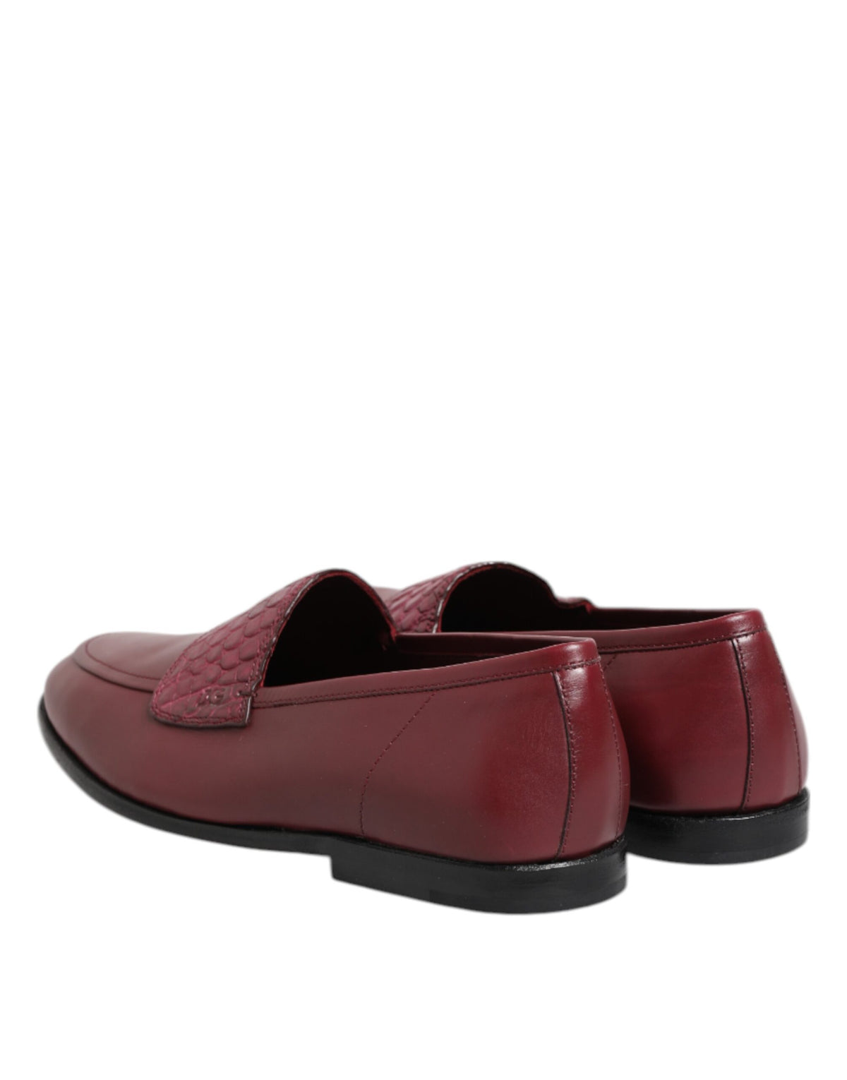 Indulge in the exquisite allure of Dolce & Gabbana's Burgundy Leather Formal Slip On Shoes, where luxurious calfskin and caiman leather meet timeless elegance for the discerning individual.