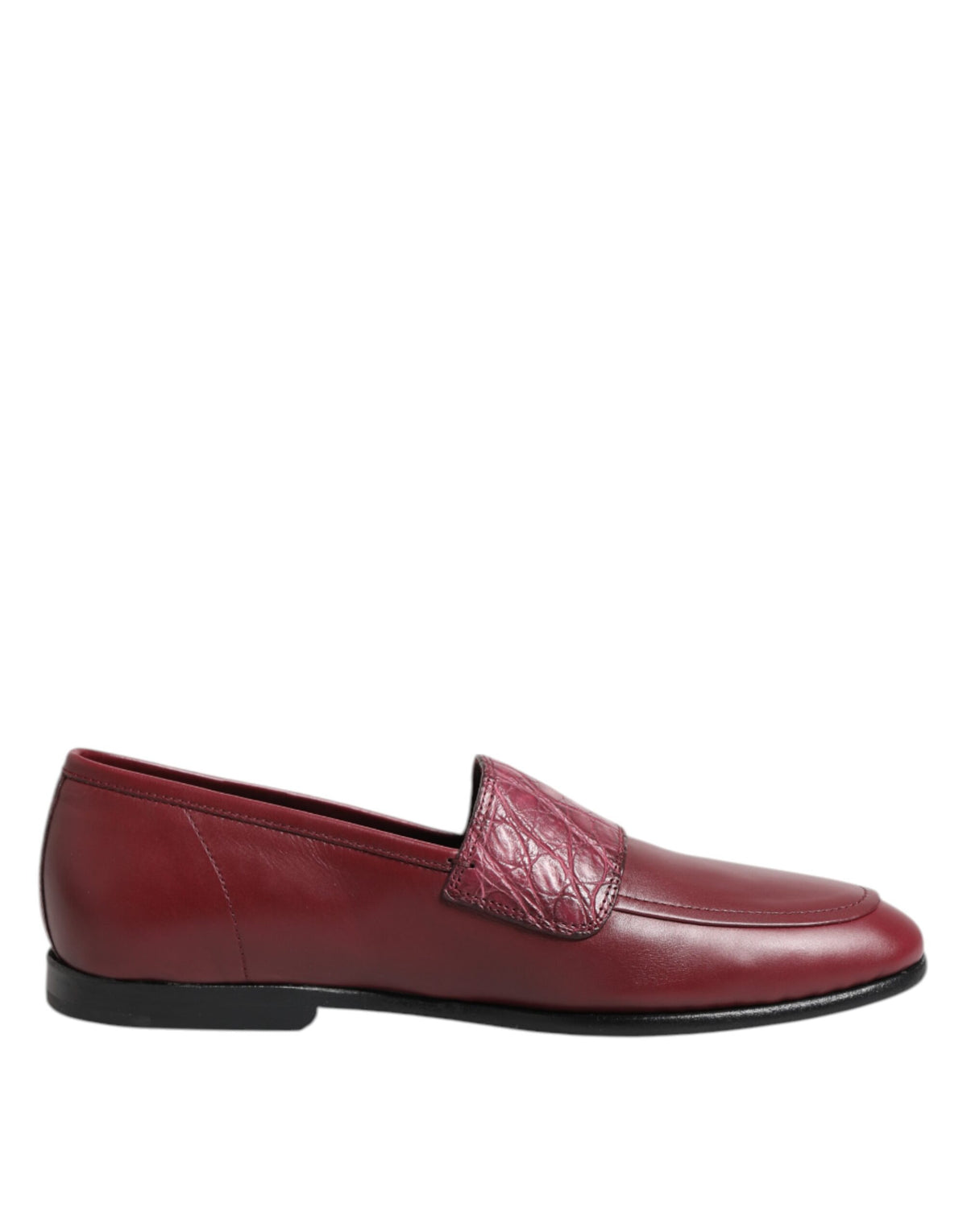 Indulge in the exquisite allure of Dolce & Gabbana Burgundy Leather Formal Slip On Shoes, where luxurious calfskin and caiman leather meet timeless elegance for the discerning individual.