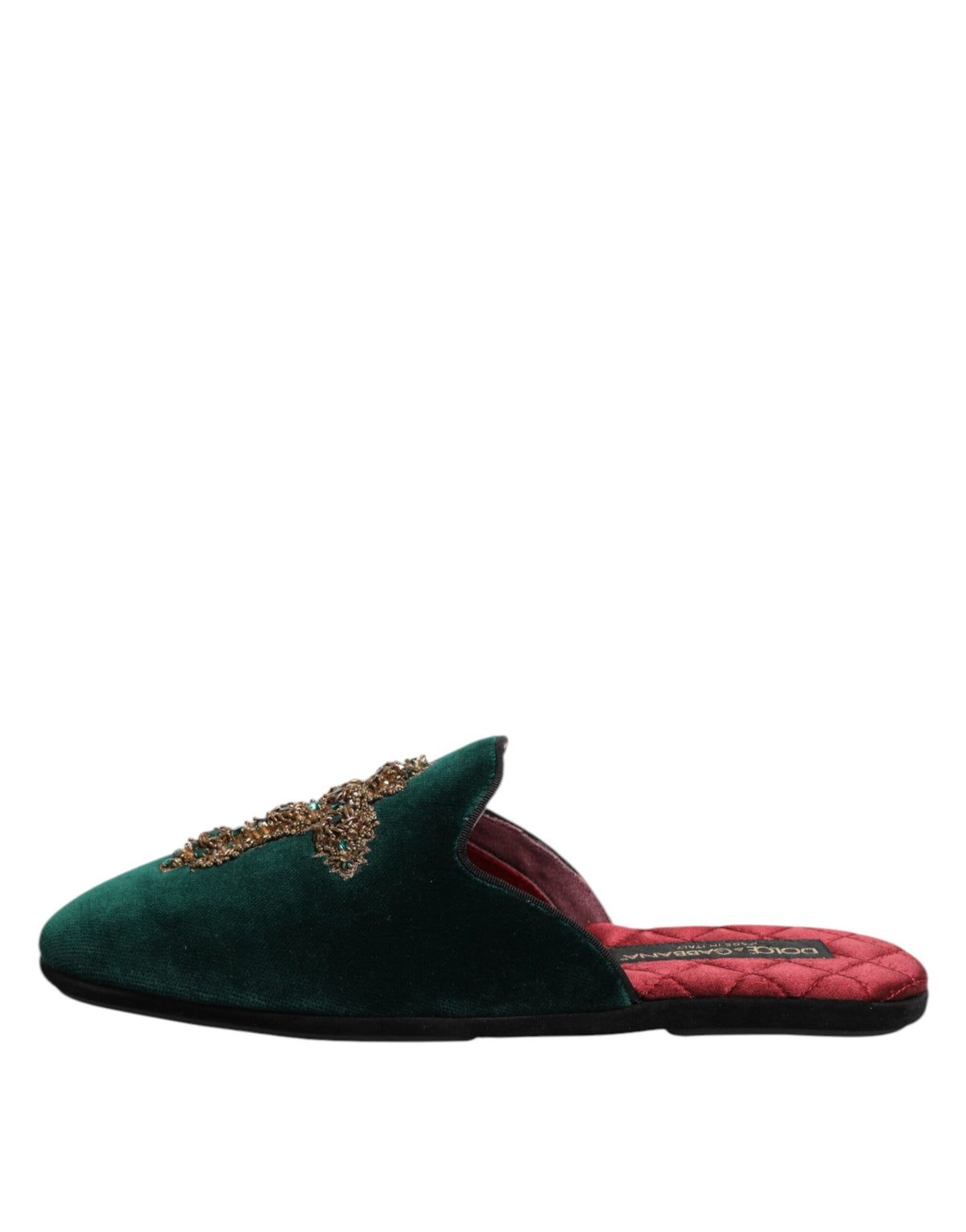 Experience the allure of Dolce & Gabbana's Green Velvet Cross Embellished Slippers, where luxurious craftsmanship meets exquisite style, perfect for the discerning individual.