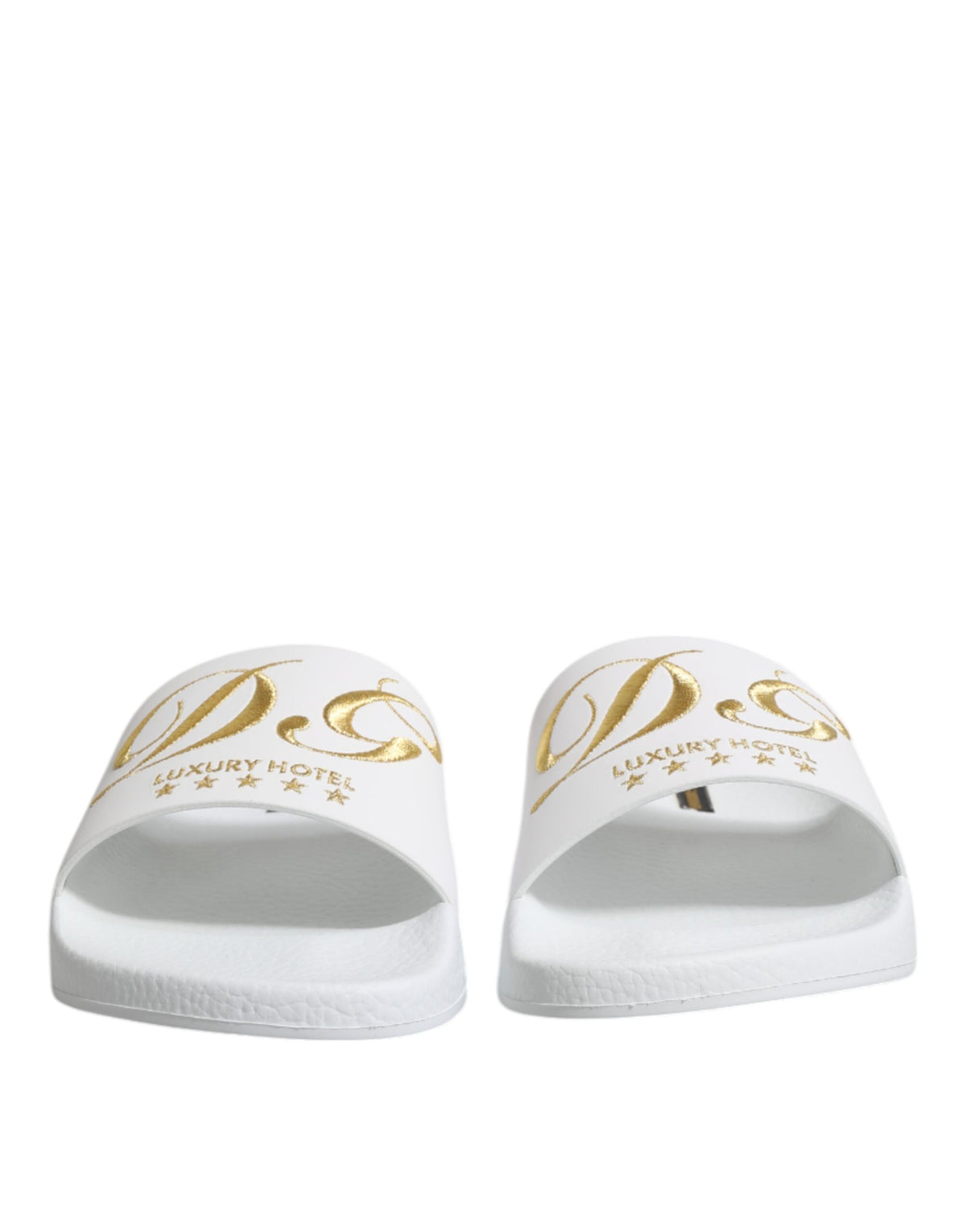Elevate your beachwear with the Dolce & Gabbana White Leather Slides, crafted from 100% calfskin leather, embodying Italian luxury and timeless sophistication.