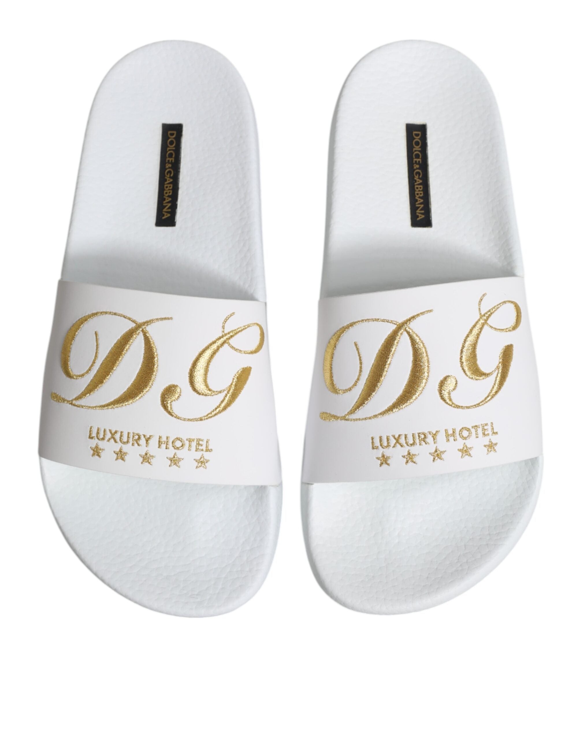 Elevate your beachwear with Dolce & Gabbana's White Leather Slides, crafted from exquisite calfskin leather, embodying luxury and sophistication for discerning tastes.