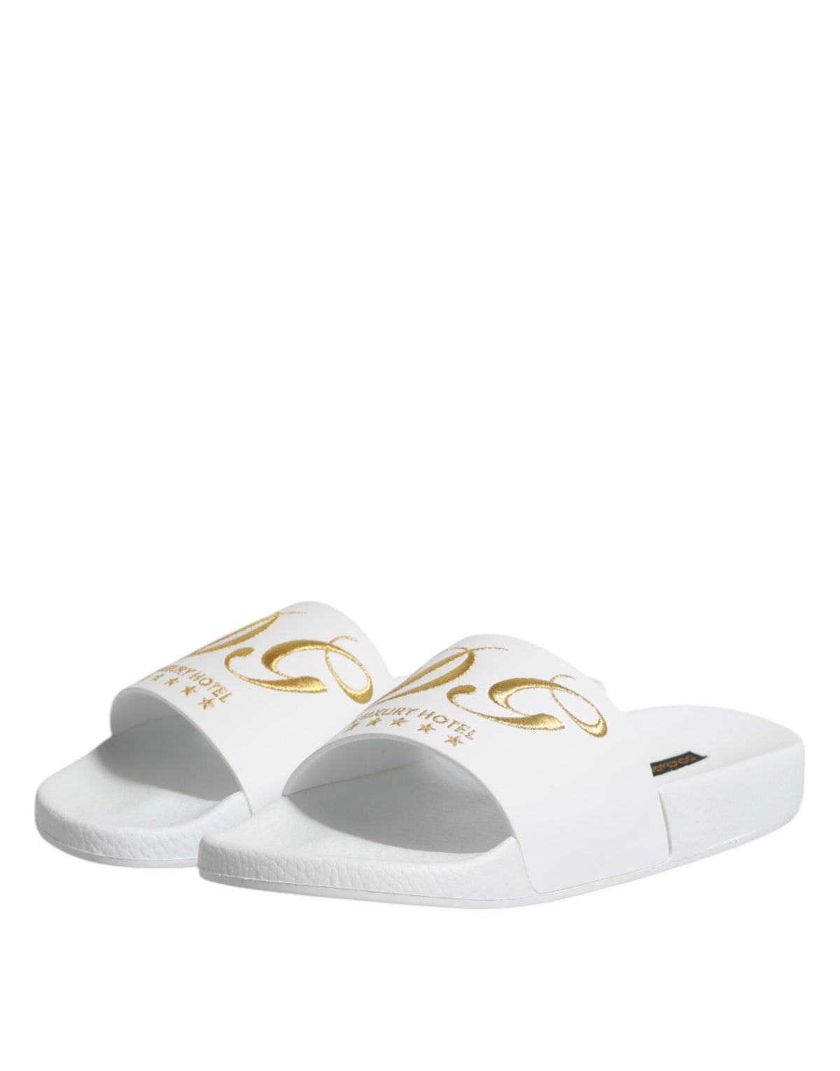 Elevate your beachwear with Dolce & Gabbana's White Leather Slides, crafted from exquisite calfskin leather, embodying Italian luxury and effortless sophistication.