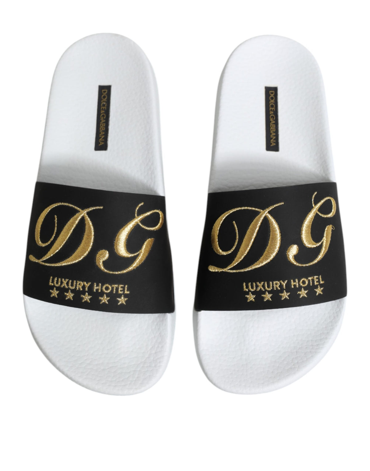 Experience the exquisite Dolce & Gabbana White Black Leather Sandals, crafted from luxurious calfskin leather, embodying artisanal elegance for the discerning individual.