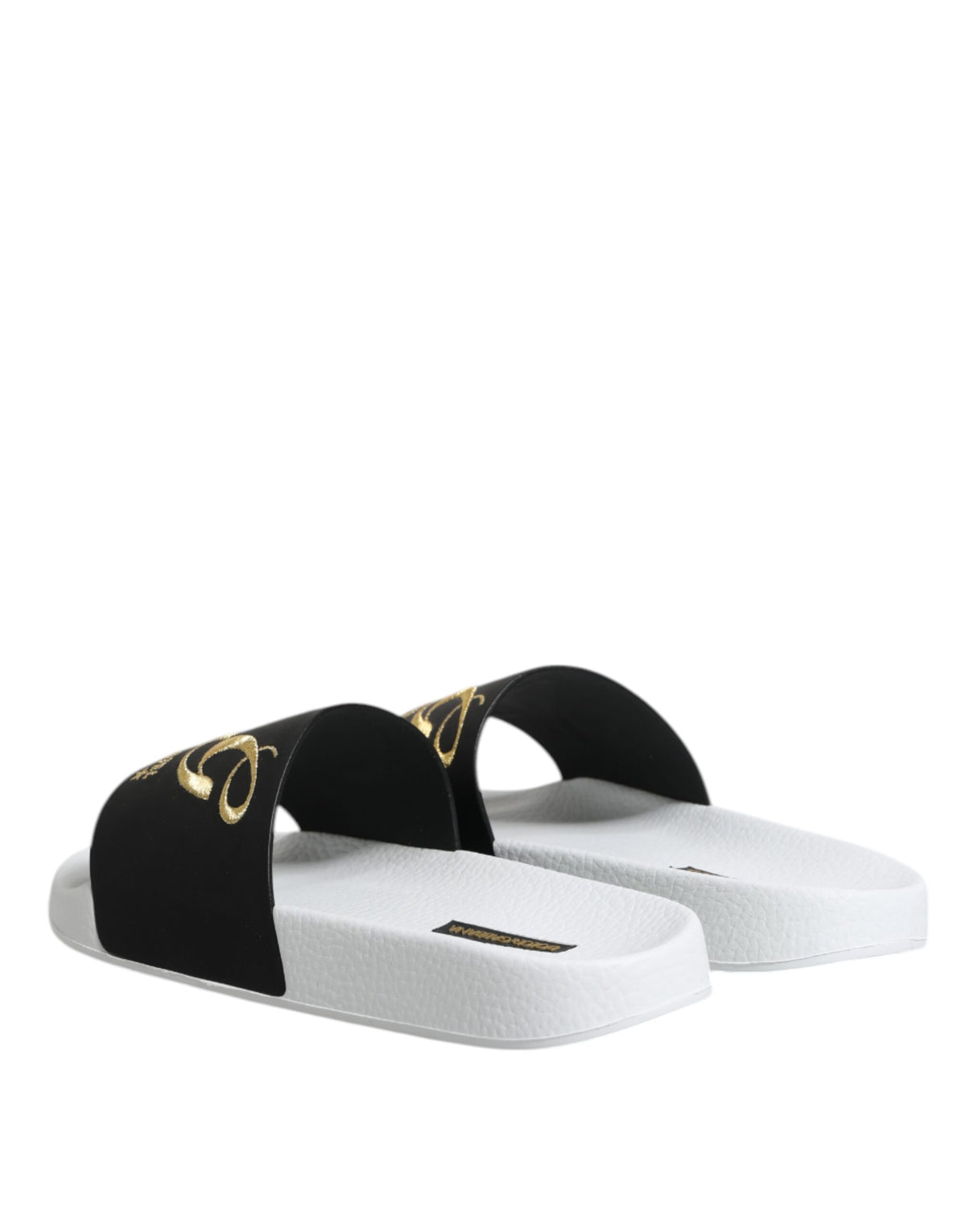 Experience the allure of Dolce & Gabbana White Black Leather Sandals, crafted from exquisite calfskin leather, embodying luxury and sophistication for every occasion.