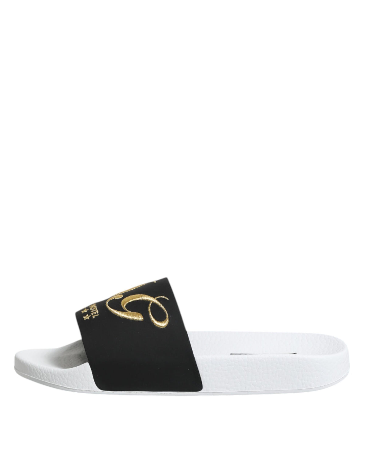 Experience the allure of Dolce & Gabbana White Black Leather Sandals, crafted from luxurious calfskin leather for effortless elegance and timeless sophistication.