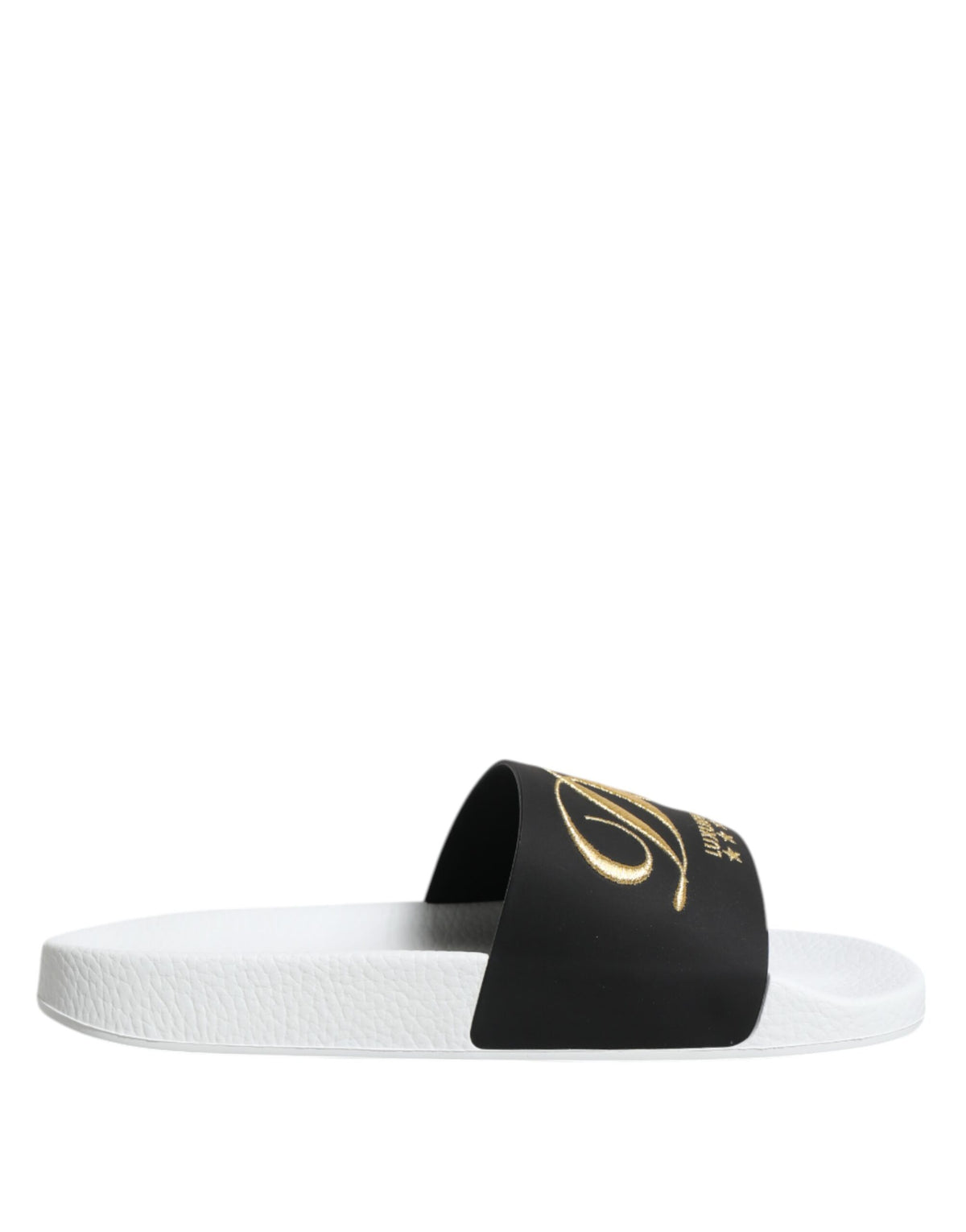 Elevate your style with Dolce & Gabbana White Black Leather Sandals, crafted from luxurious calfskin leather, embodying sophistication and artisanal elegance for every occasion.