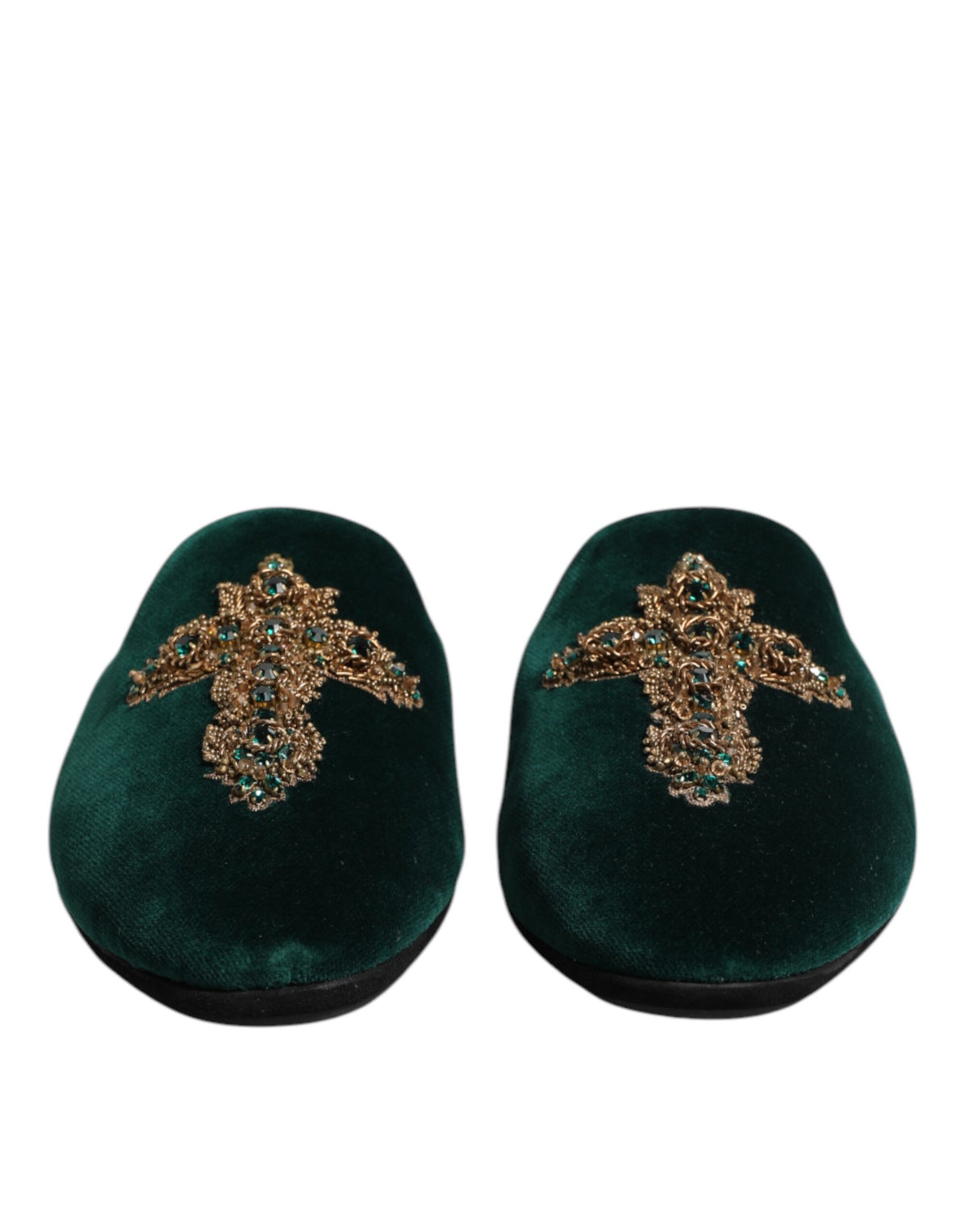 Experience the allure of Dolce & Gabbana's Green Velvet Cross Embellished Slippers, where exquisite craftsmanship meets luxurious materials for a statement of refined elegance.