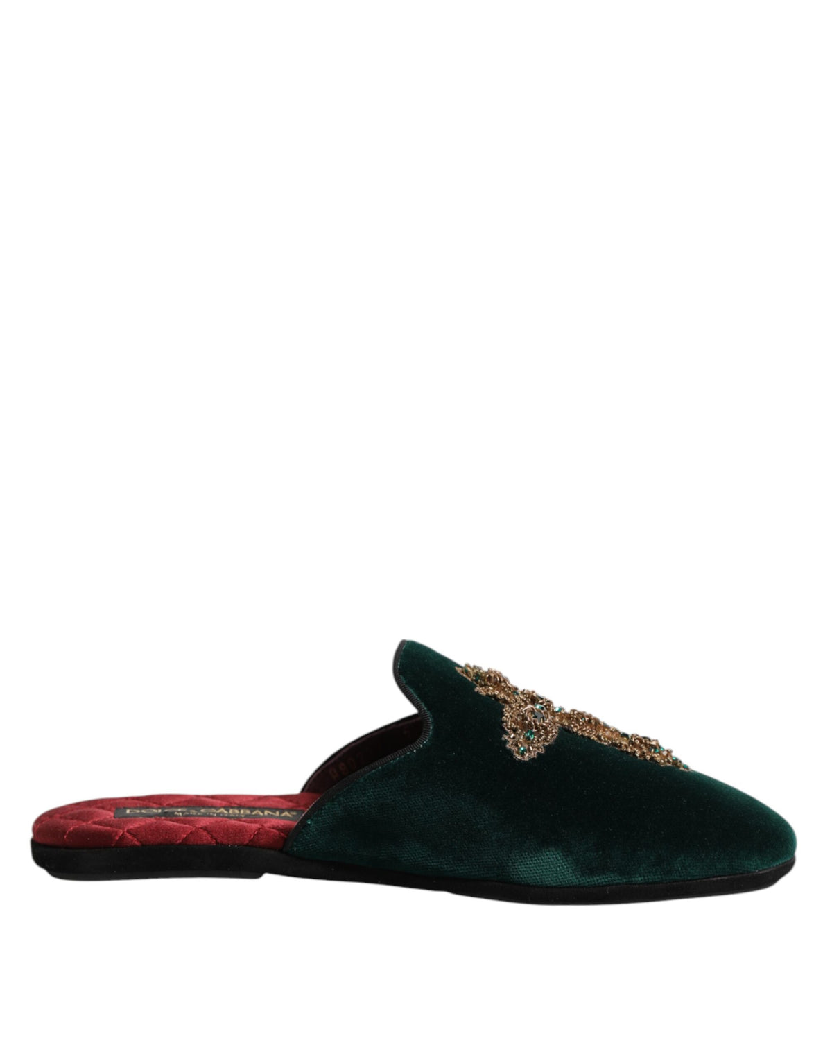 Elevate your style with Dolce & Gabbana's Green Velvet Cross Embellished Slippers, where exquisite craftsmanship meets luxurious materials for a statement of refined elegance.