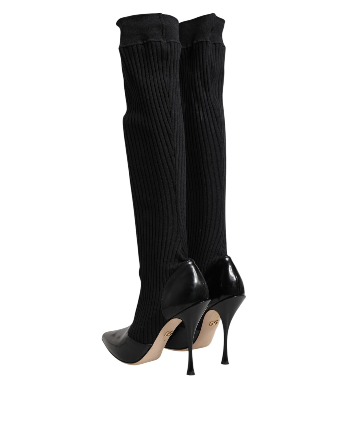 Indulge in the exquisite Dolce & Gabbana Black Leather Ribbed Knit Knee Boots, where Italian craftsmanship meets timeless elegance, elevating your every step with luxurious allure.