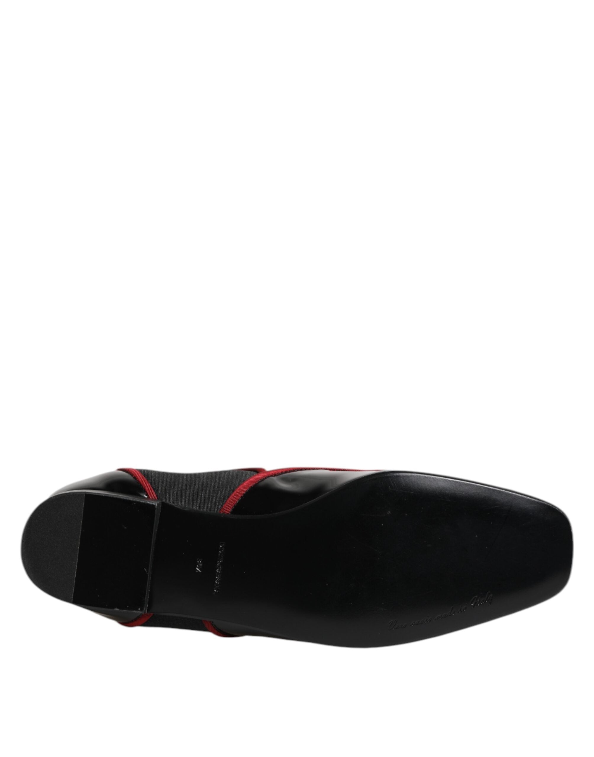 Indulge in the exquisite Dolce & Gabbana Black Jackie Buttoned Chelsea Boots, crafted from luxurious calf leather, embodying timeless elegance and artisanal mastery for the discerning individual.
